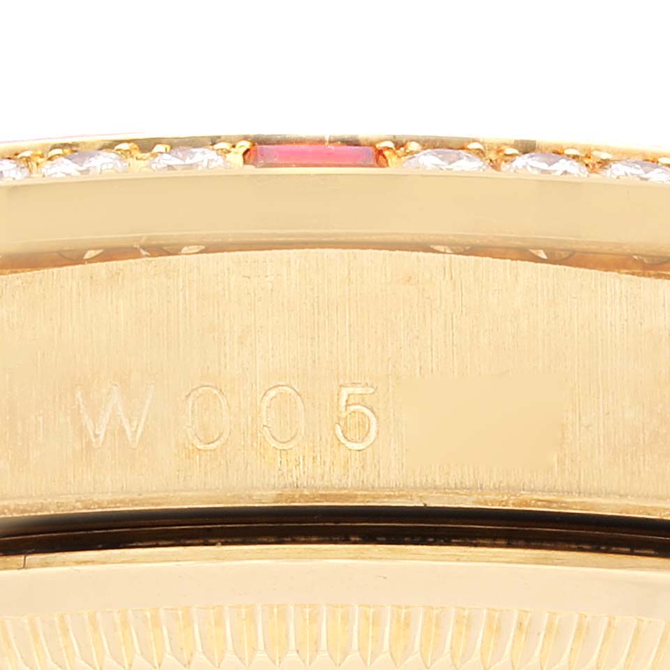 This image shows a close-up of the side of a Rolex President 18378 Men
s Yellow Gold Champagne Dial 18378 Men
s Yellow Gold Champagne Dial model watch with engraving and part of the bezel with diamonds.