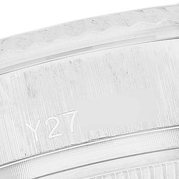 This close-up image shows the engraved serial number on the side of a Rolex President 179179 Women's White Gold Silver Dial 179179 Women's White Gold Silver Dial watch.