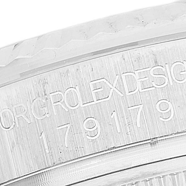 The image shows a close-up of the engraved side of a Rolex President 179179 Women's White Gold Silver Dial 179179 Women's White Gold Silver Dial model watch, highlighting the brand and serial number.