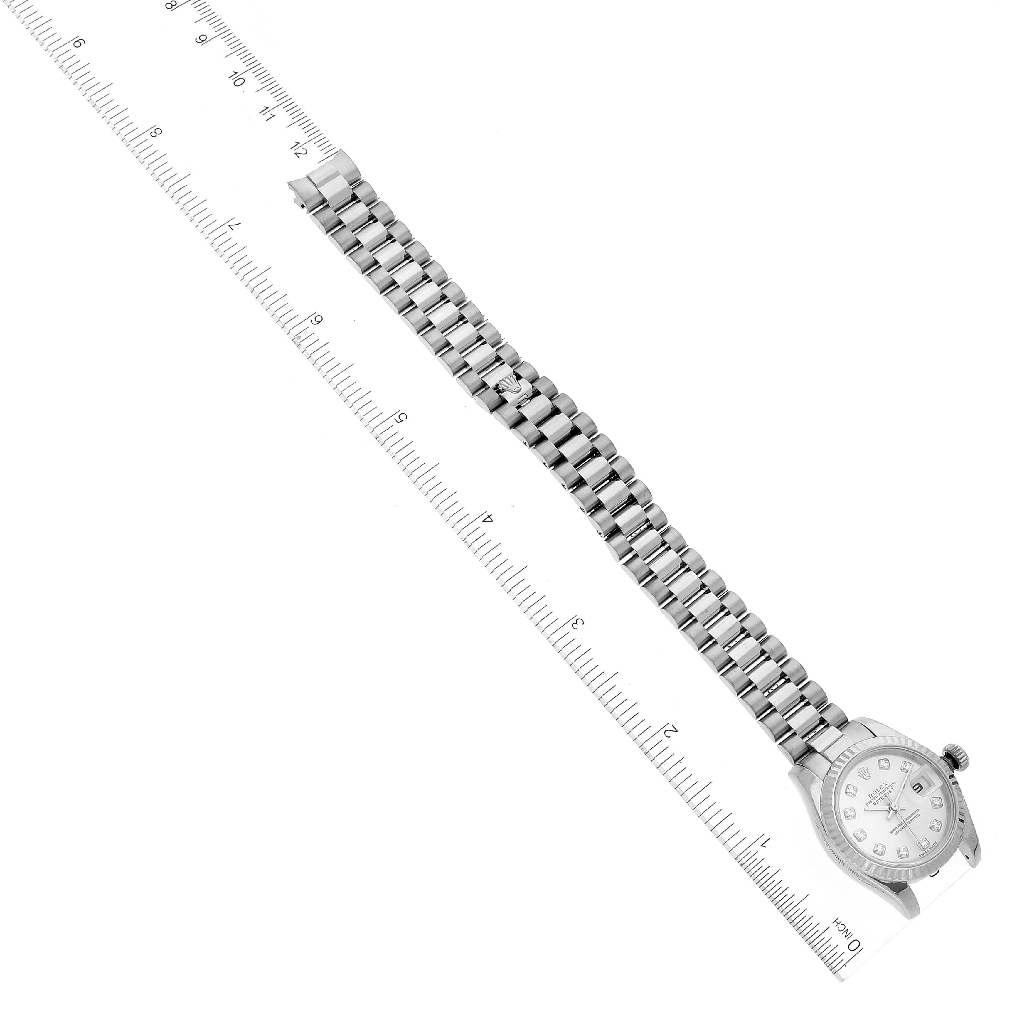 The image shows a top view of a Rolex President 179179 Women's White Gold Silver Dial 179179 Women's White Gold Silver Dial model watch, focusing on the face and entire bracelet, with a ruler for sizing.