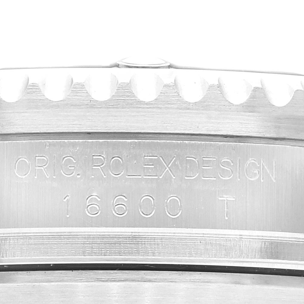 This close-up image shows the side engraving and part of the bezel of the Rolex Sea-Dweller 16600 Men
s Stainless Steel Black Dial 16600 Men
s Stainless Steel Black Dial model 16600.