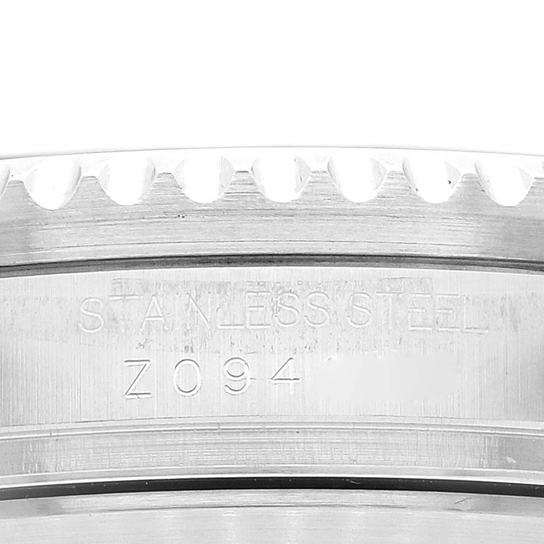 This close-up image of a Rolex Sea-Dweller 16600 Men
s Stainless Steel Black Dial 16600 Men
s Stainless Steel Black Dial watch displays the stainless steel marking and part of the case edge.