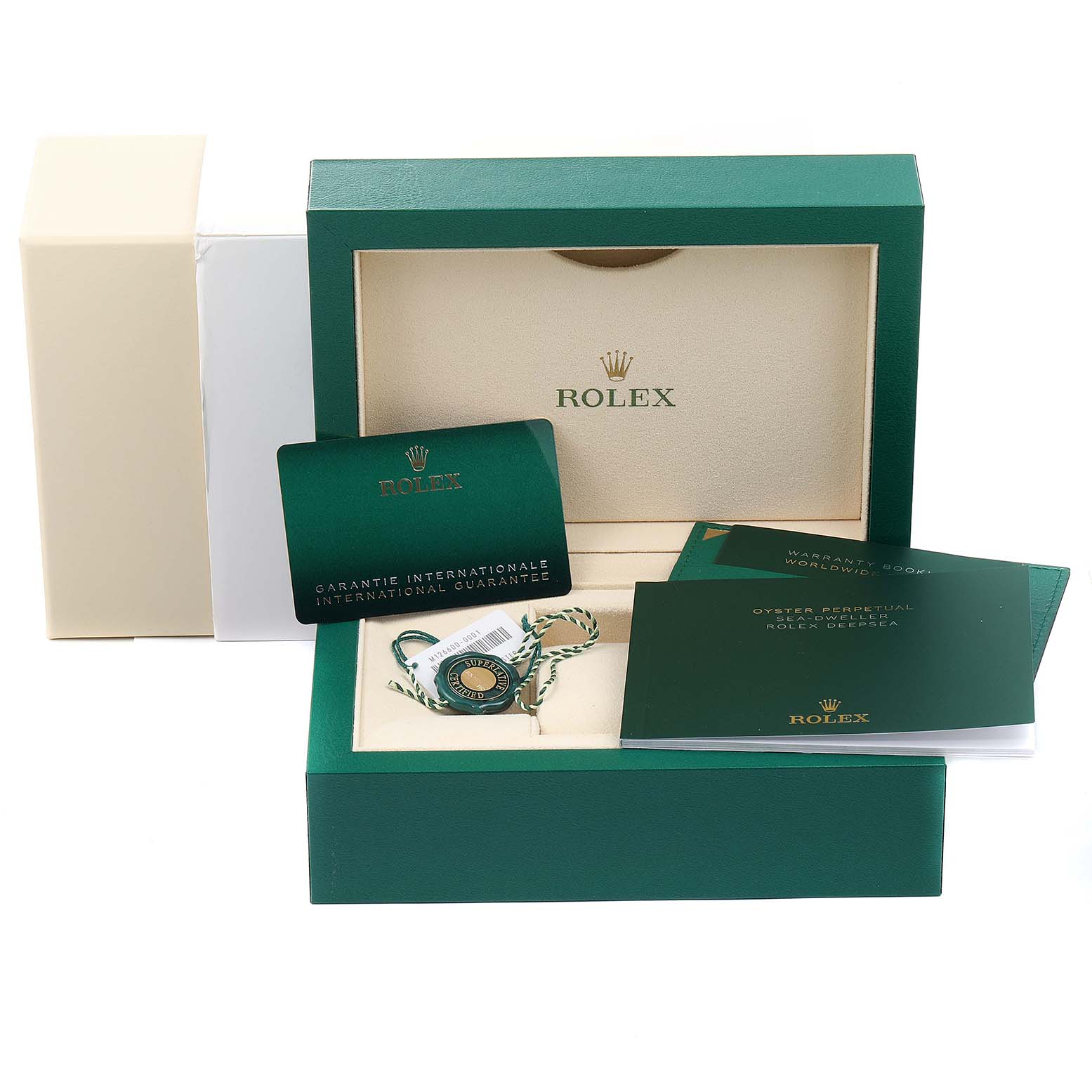 The image shows the inside contents of a Rolex Sea-Dweller 126600 Men
s Stainless Steel Black Dial 126600 Men
s Stainless Steel Black Dial watch box, including guarantee cards, booklets, and tags.