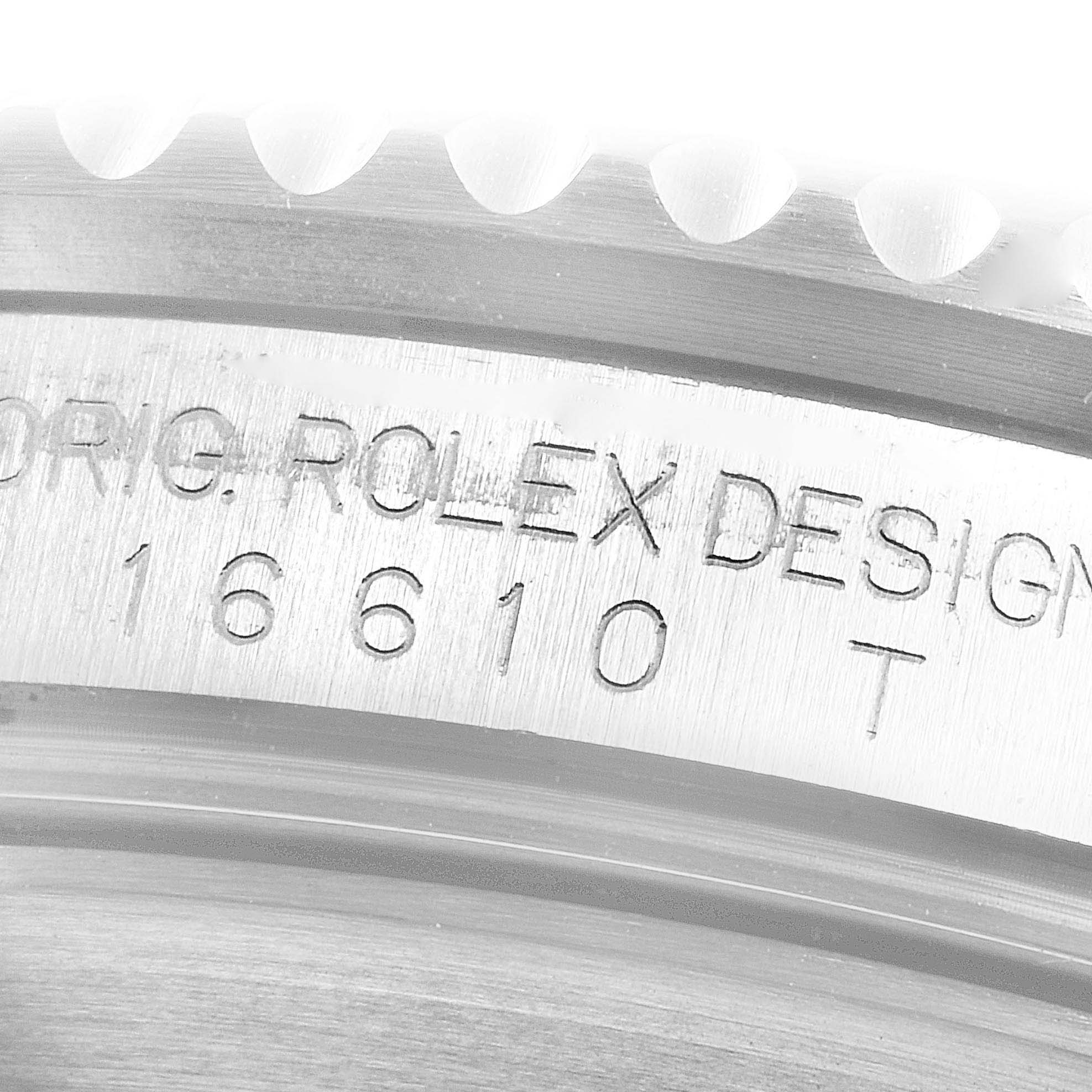 This close-up image shows the engravings on the side of the bezel of a Rolex Submariner 16610 Men
s Stainless Steel Black Dial 16610 Men
s Stainless Steel Black Dial model 16610.