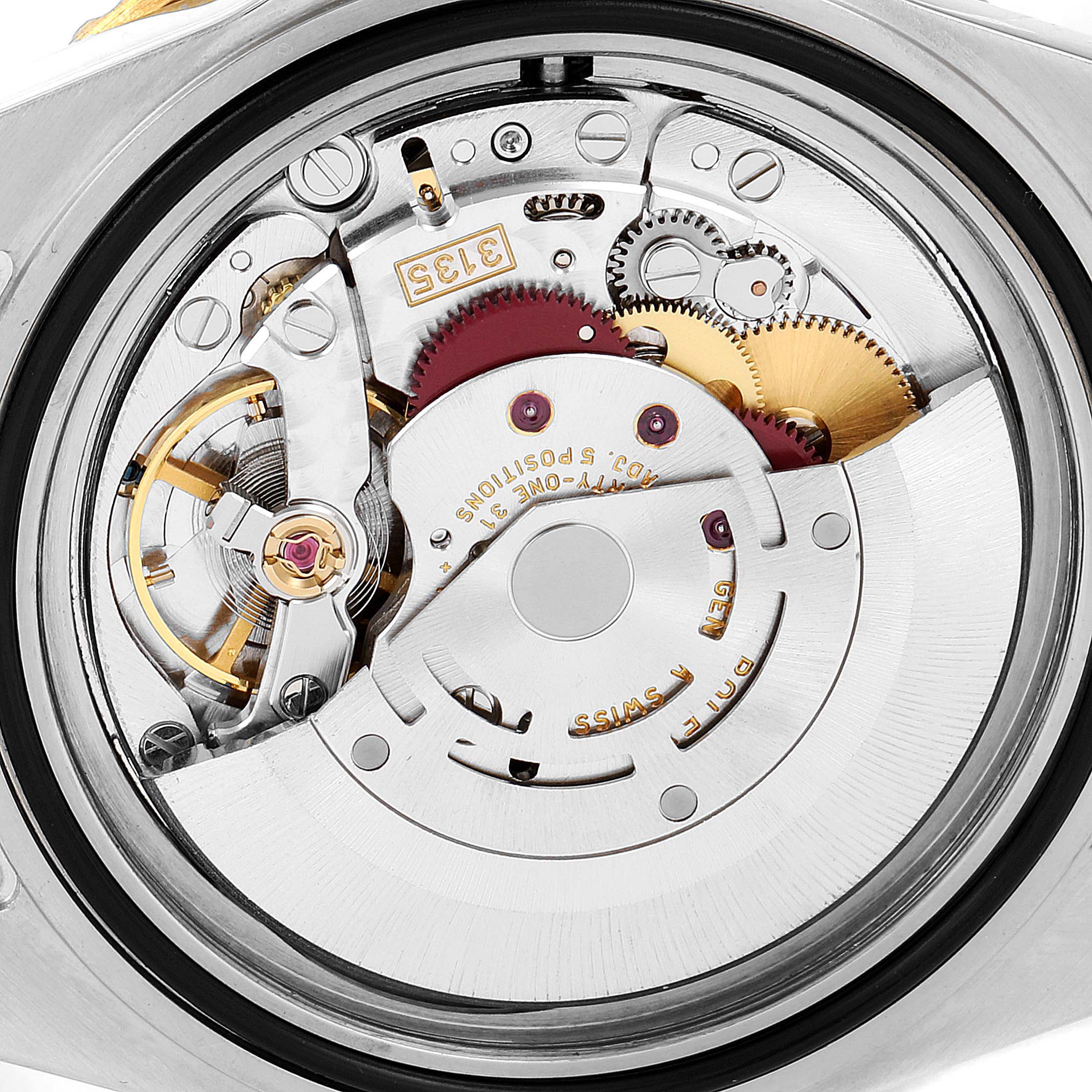 This image shows the intricate internal movement mechanism of the Rolex Submariner 16613 Men's Steel and Gold (two tone) Champagne Dial 16613 Men's Steel and Gold (two tone) Champagne Dial watch from a close-up angle.