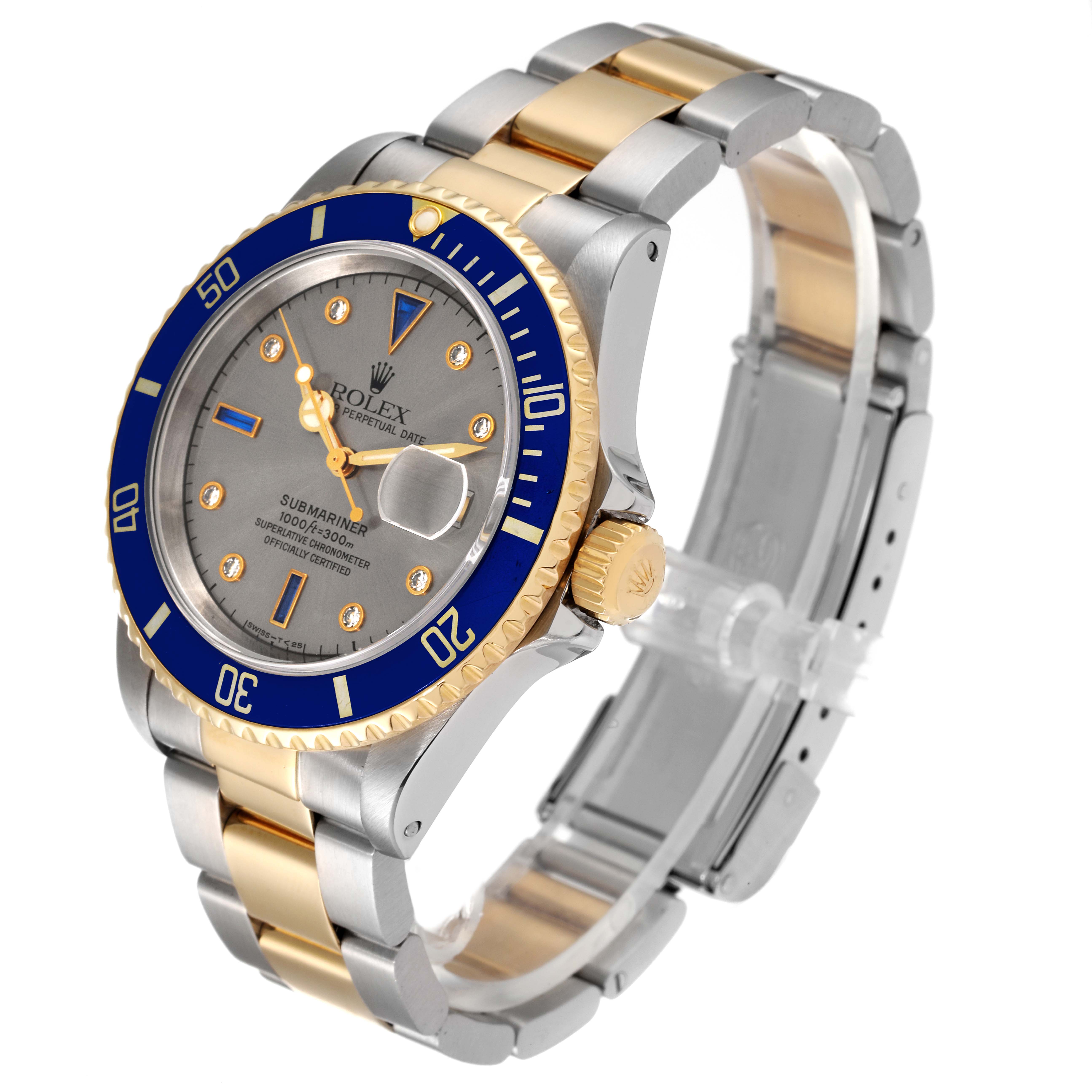 This image shows a Rolex Submariner 16613 Men
s Steel and Gold (two tone) Grey Dial 16613 Men
s Steel and Gold (two tone) Grey Dial watch at a three-quarter angle, highlighting its blue bezel, two-tone bracelet, and dial.