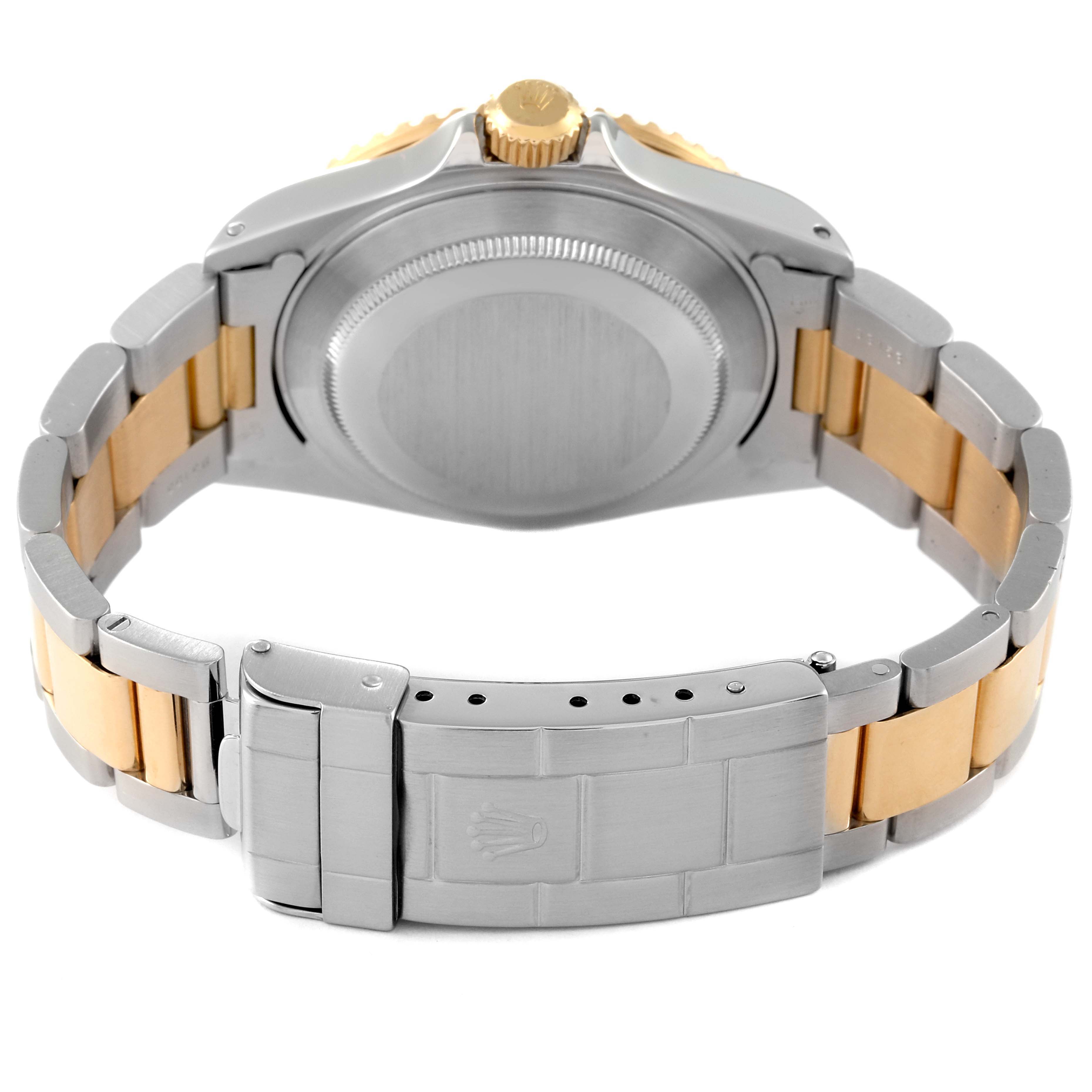 This image shows the back side of a Rolex Submariner 16613 Men
s Steel and Gold (two tone) Grey Dial 16613 Men
s Steel and Gold (two tone) Grey Dial watch, highlighting the clasp, bracelet, and case back.