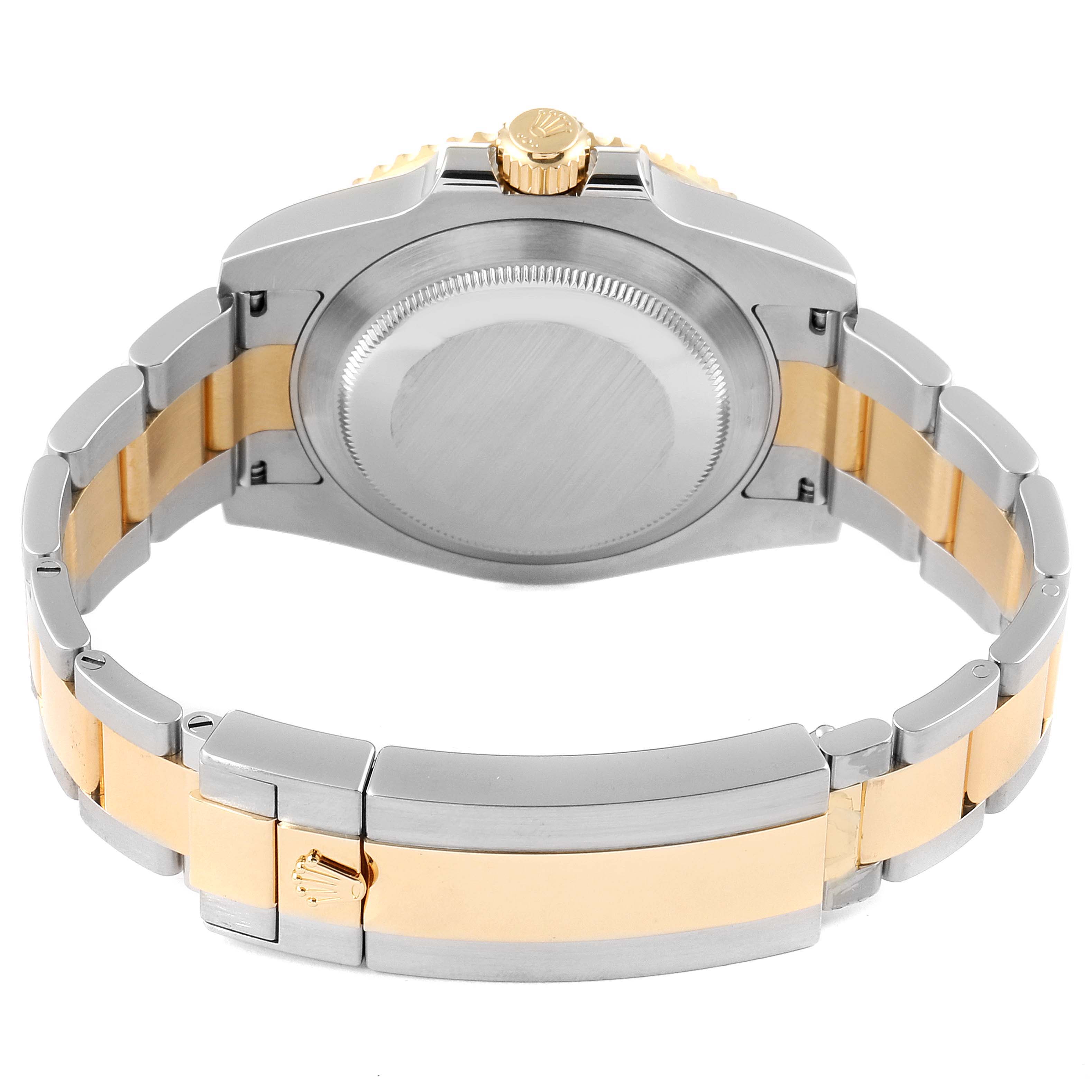 The image shows the back, crown, and bracelet of a Rolex Submariner 116613 Men's Steel and Gold (two tone) Black Dial 116613 Men's Steel and Gold (two tone) Black Dial watch.