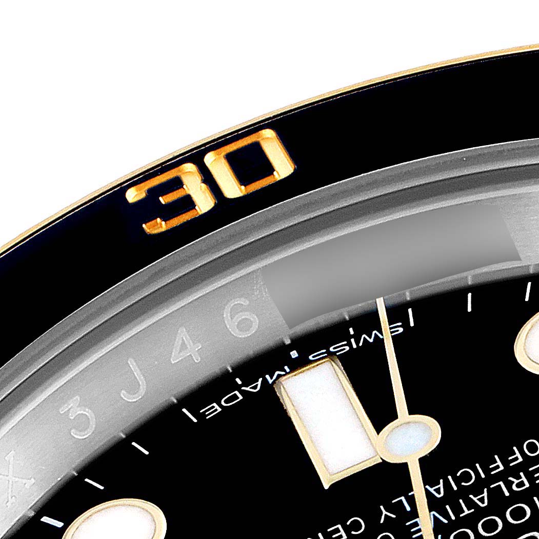 The image shows a close-up view of the dial and bezel of a Rolex Submariner 116613 Men's Steel and Gold (two tone) Black Dial 116613 Men's Steel and Gold (two tone) Black Dial watch, focusing on the 30-minute marker.