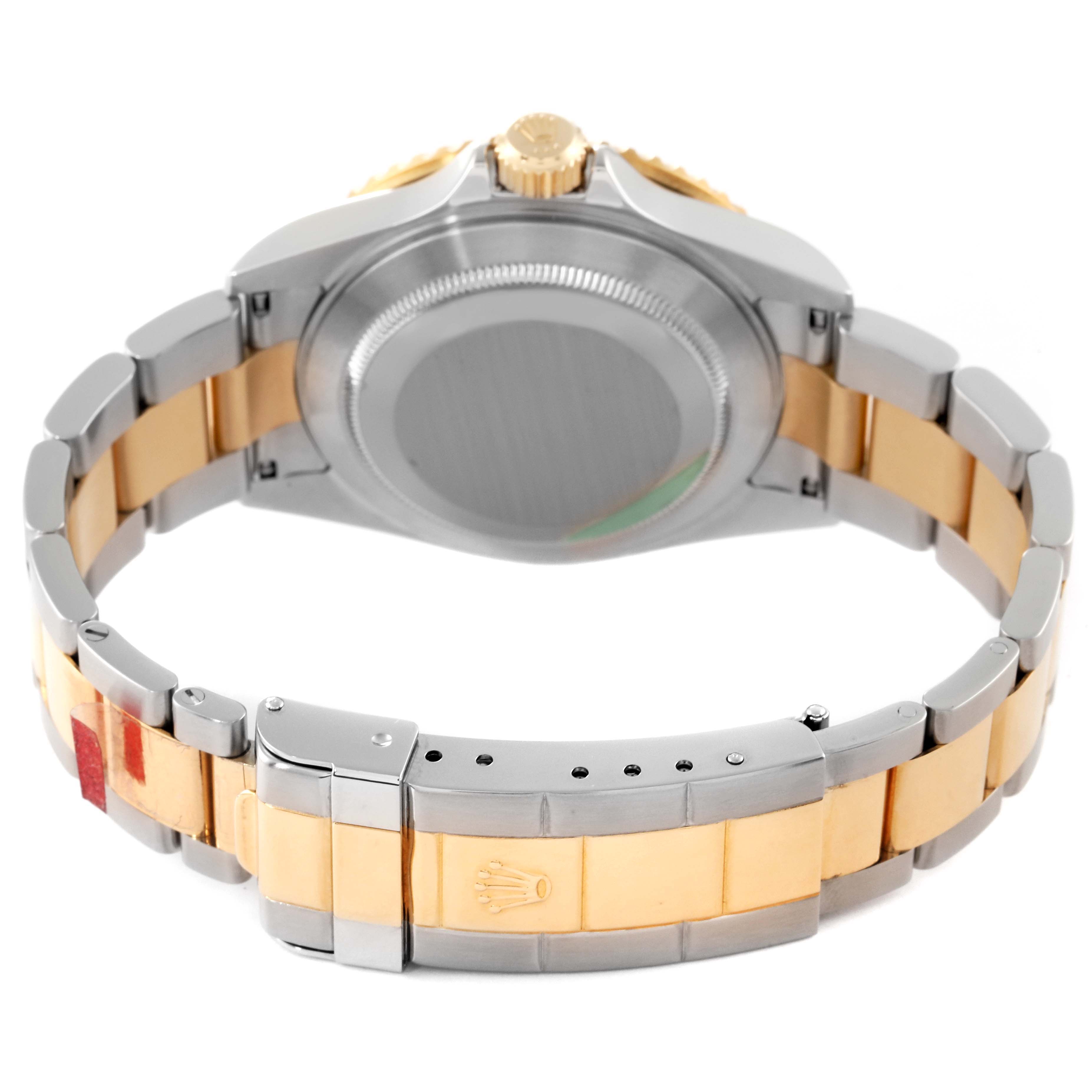 The image shows the back and bracelet of a Rolex Submariner 16613 Men's Steel and Gold (two tone) Blue Dial 16613 Men's Steel and Gold (two tone) Blue Dial watch, highlighting the clasp and crown.