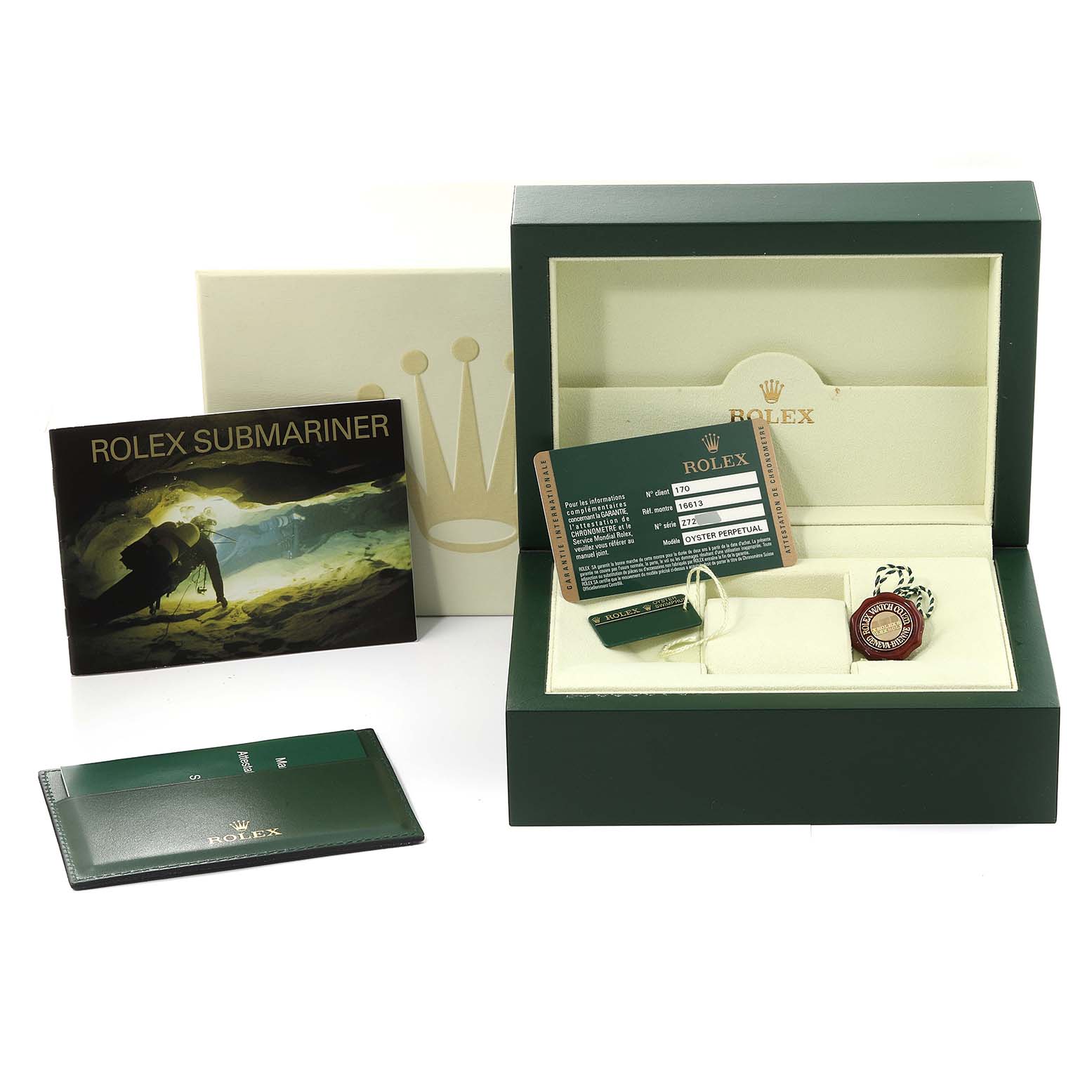 The image shows the packaging, manual, warranty card, and accessories for the Rolex Submariner 16613 Men's Steel and Gold (two tone) Blue Dial 16613 Men's Steel and Gold (two tone) Blue Dial model.