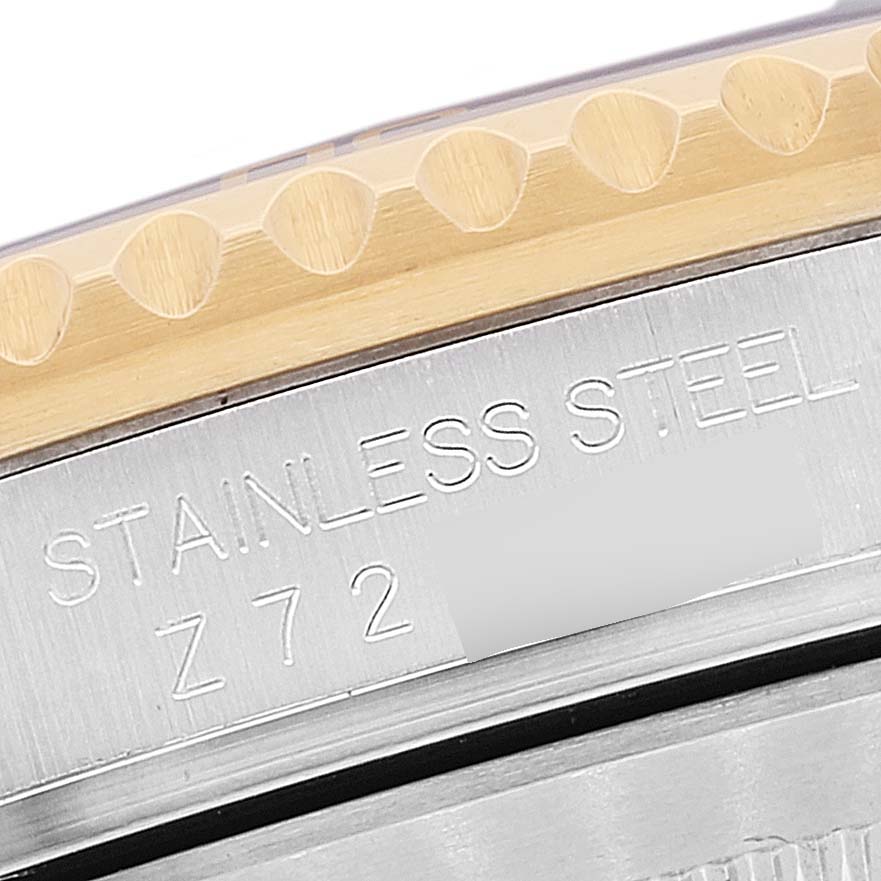 This close-up image of the Rolex Submariner 16613 Men's Steel and Gold (two tone) Blue Dial 16613 Men's Steel and Gold (two tone) Blue Dial shows the stainless steel case and part of the gold bezel.