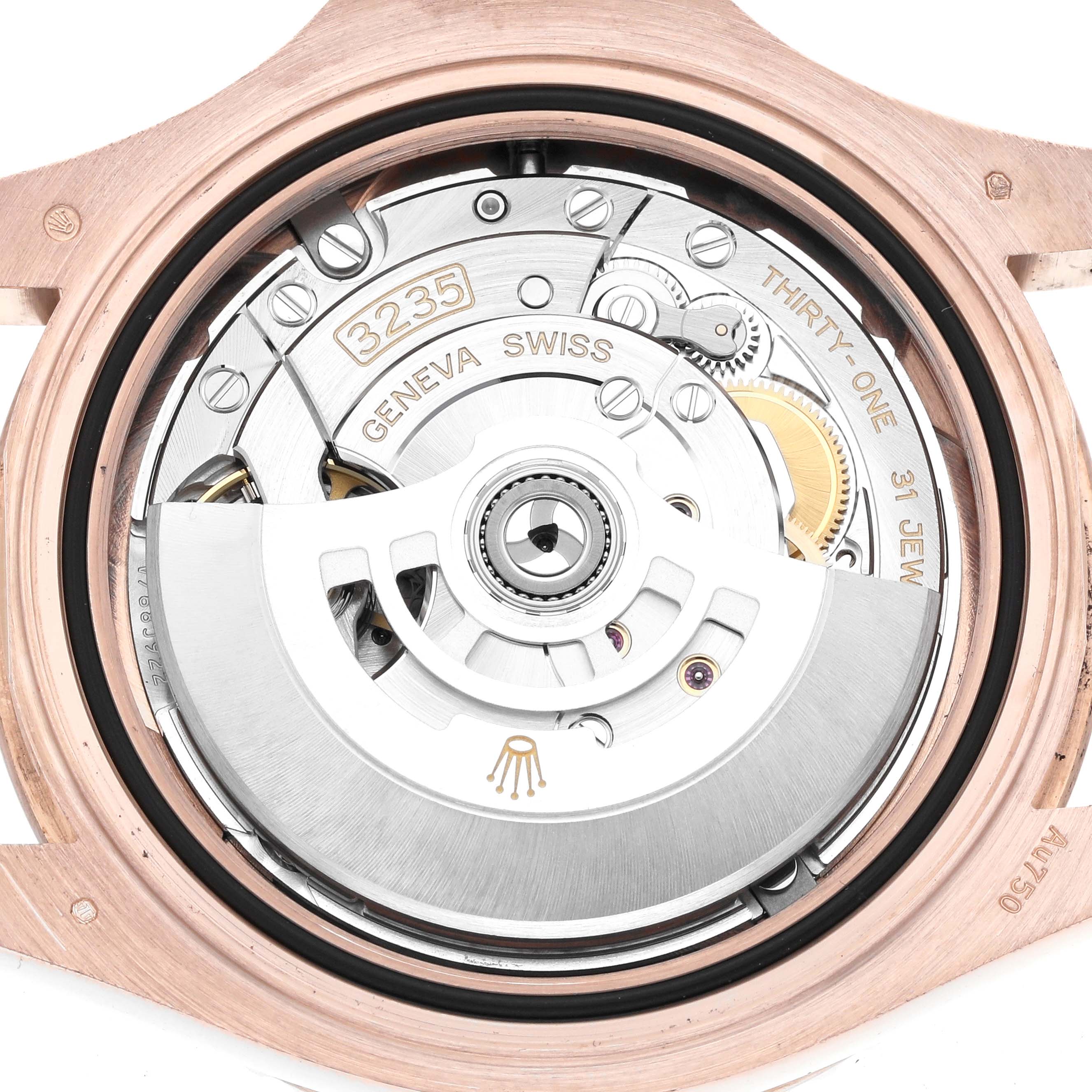 The image shows the movement of a Rolex Yacht-Master 126655 Men's Rose Gold Black Dial watch from the back, highlighting the intricate mechanics and rotor.