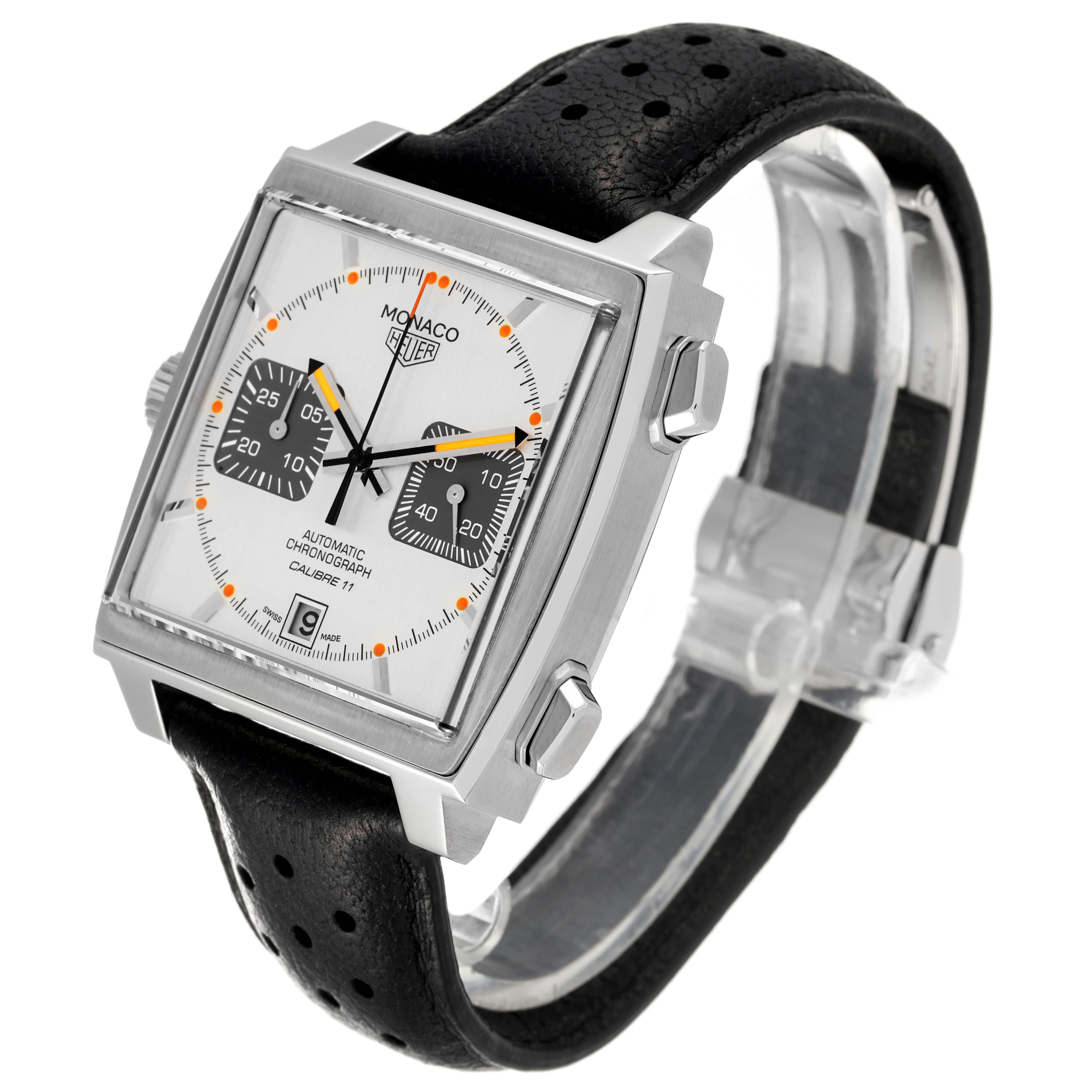 The image shows a side angle of the Tag Heuer Monaco watch, highlighting its square face, chronograph dials, and black leather strap.