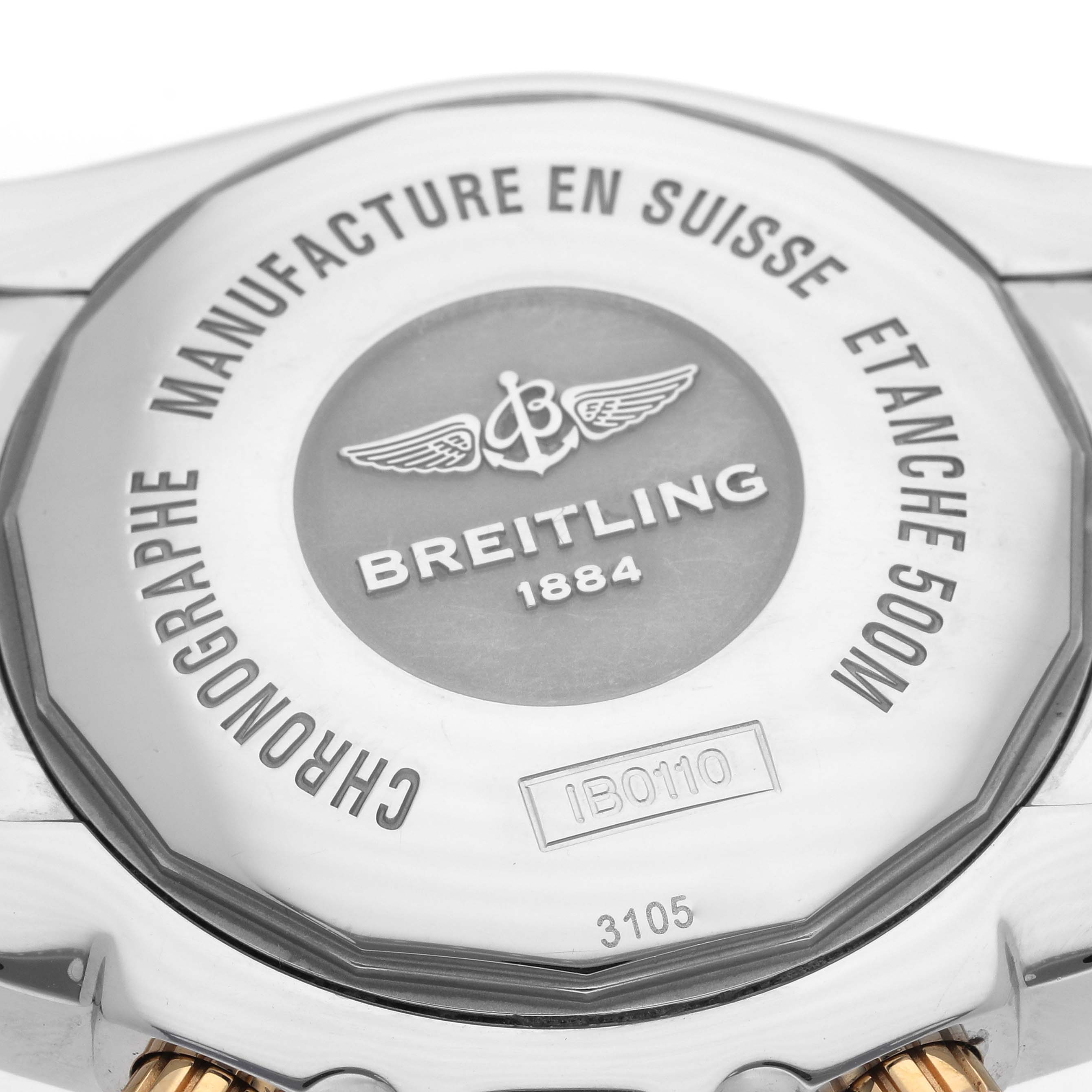 The image shows the back casing of a Breitling Chronomat IB0110 Men's Steel and Gold (two tone) Black Dial IB0110 Men's Steel and Gold (two tone) Black Dial watch, highlighting the brand's engraving and model details.