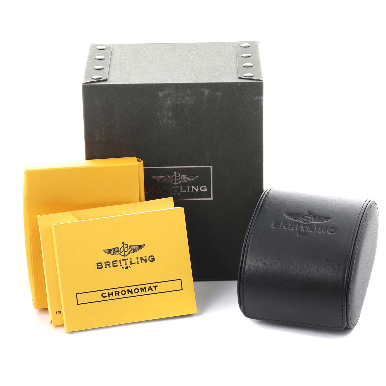 The image shows a Breitling Chronomat IB0110 Men's Steel and Gold (two tone) Black Dial IB0110 Men's Steel and Gold (two tone) Black Dial box, case, and yellow manuals from a slightly elevated front angle.