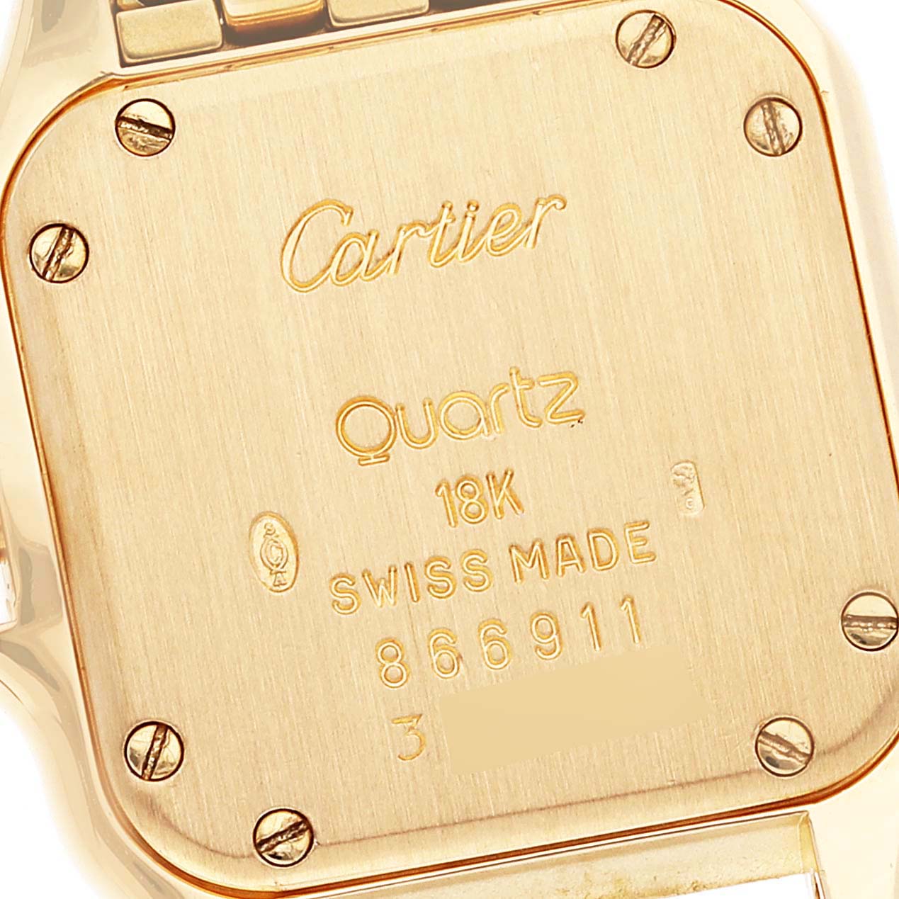 This image shows the back case of a Cartier Panthere W25022B9 Women's Yellow Gold Silver Dial W25022B9 Women's Yellow Gold Silver Dial model watch, highlighting the inscriptions and screws.