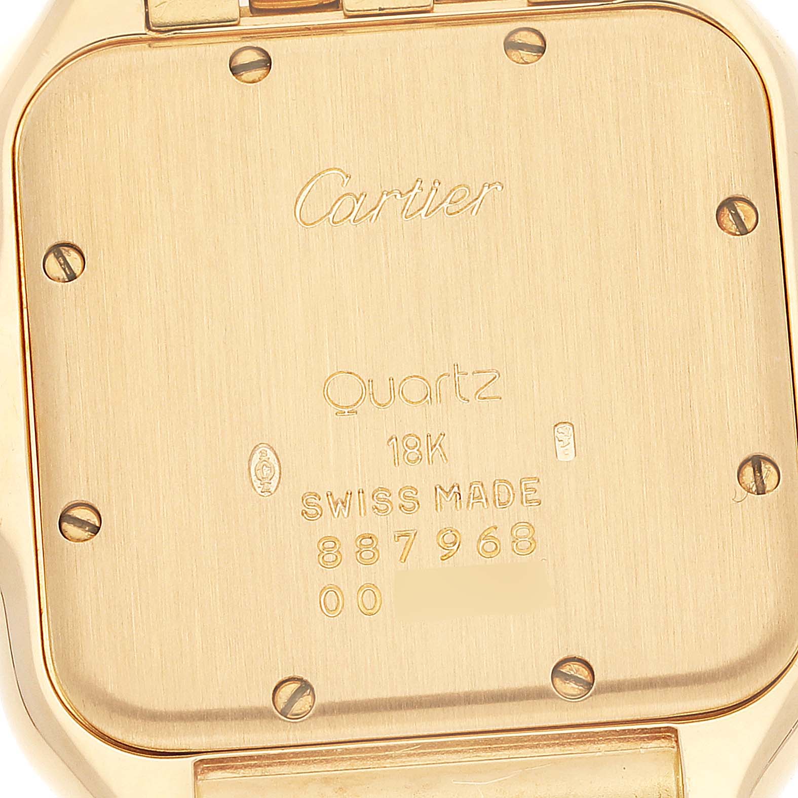This image shows the back of a Cartier Panthere W25014B9 Women's Yellow Gold Silver Dial W25014B9 Women's Yellow Gold Silver Dial watch, highlighting its inscriptions and screws.