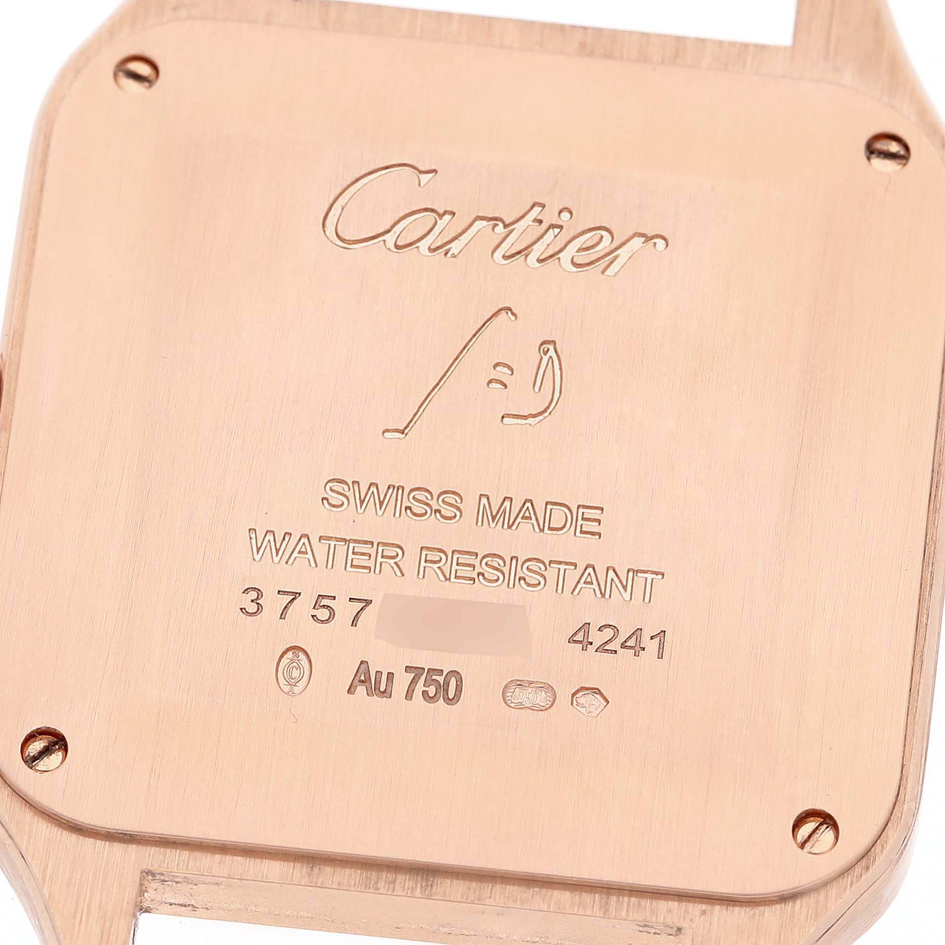 This image shows the back casing of a Cartier Santos WJSA0016 Women's Rose Gold Silver Dial WJSA0016 Women's Rose Gold Silver Dial watch, highlighting the brand name and material details.