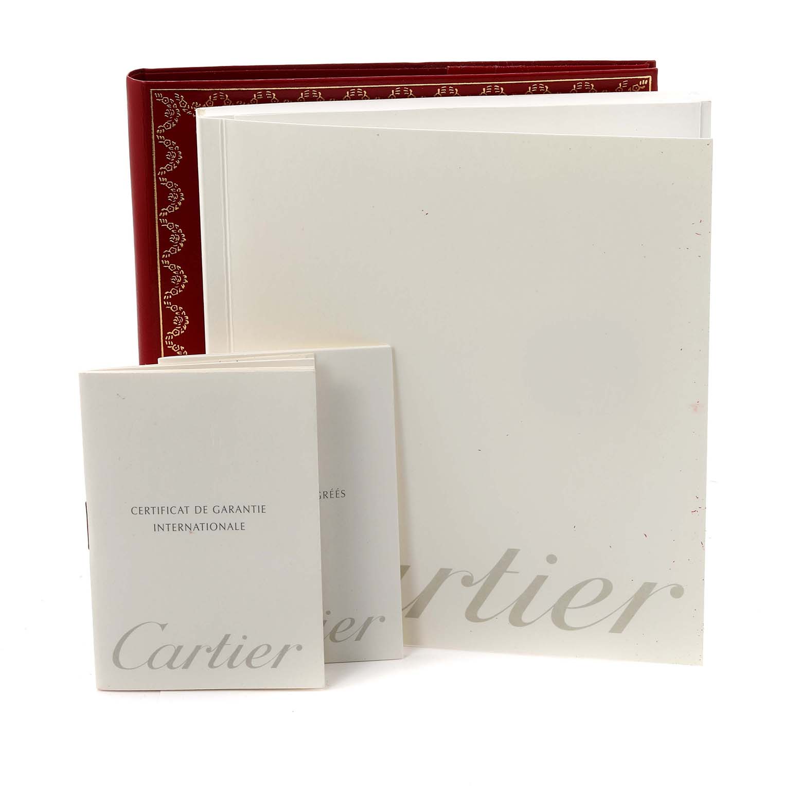 The image shows the paperwork and packaging accessories for a Cartier Tank Francaise W51008Q3 Women's Stainless Steel Silver Dial W51008Q3 Women's Stainless Steel Silver Dial watch.