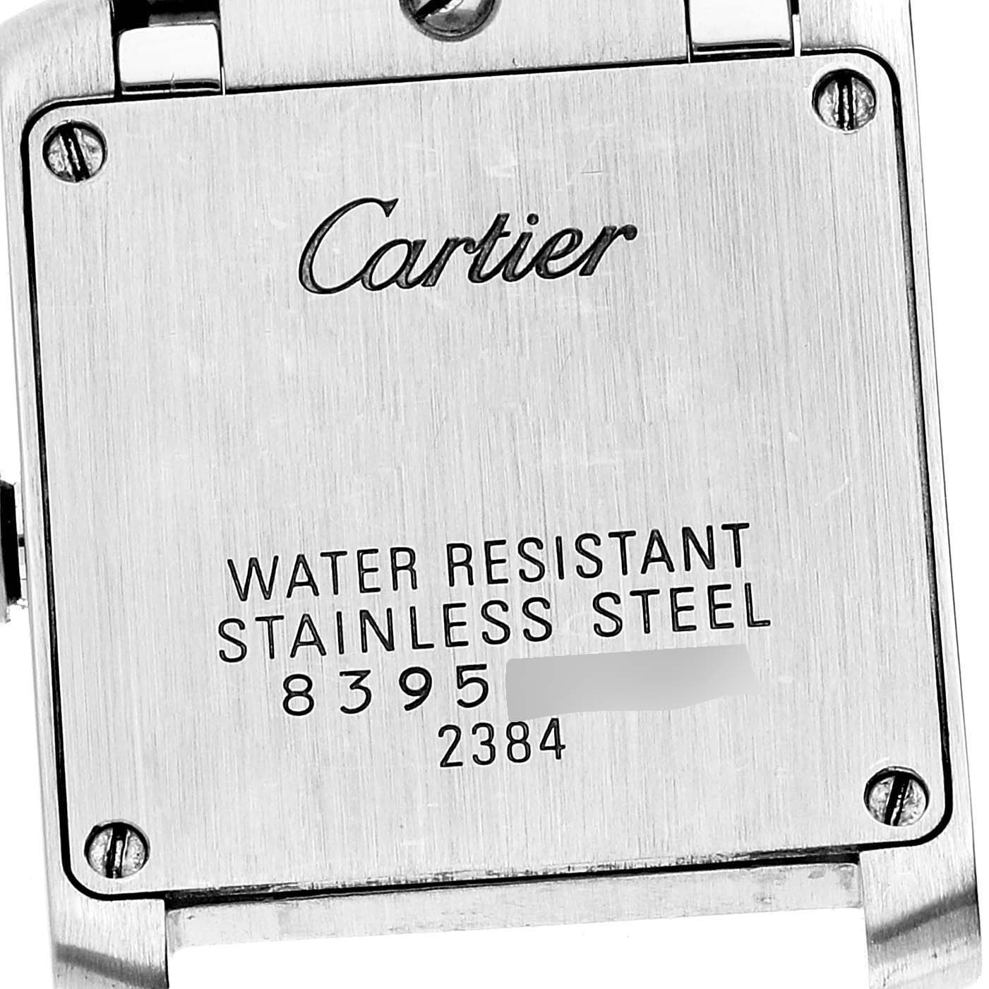 The image shows the back case of a Cartier Tank Française watch.