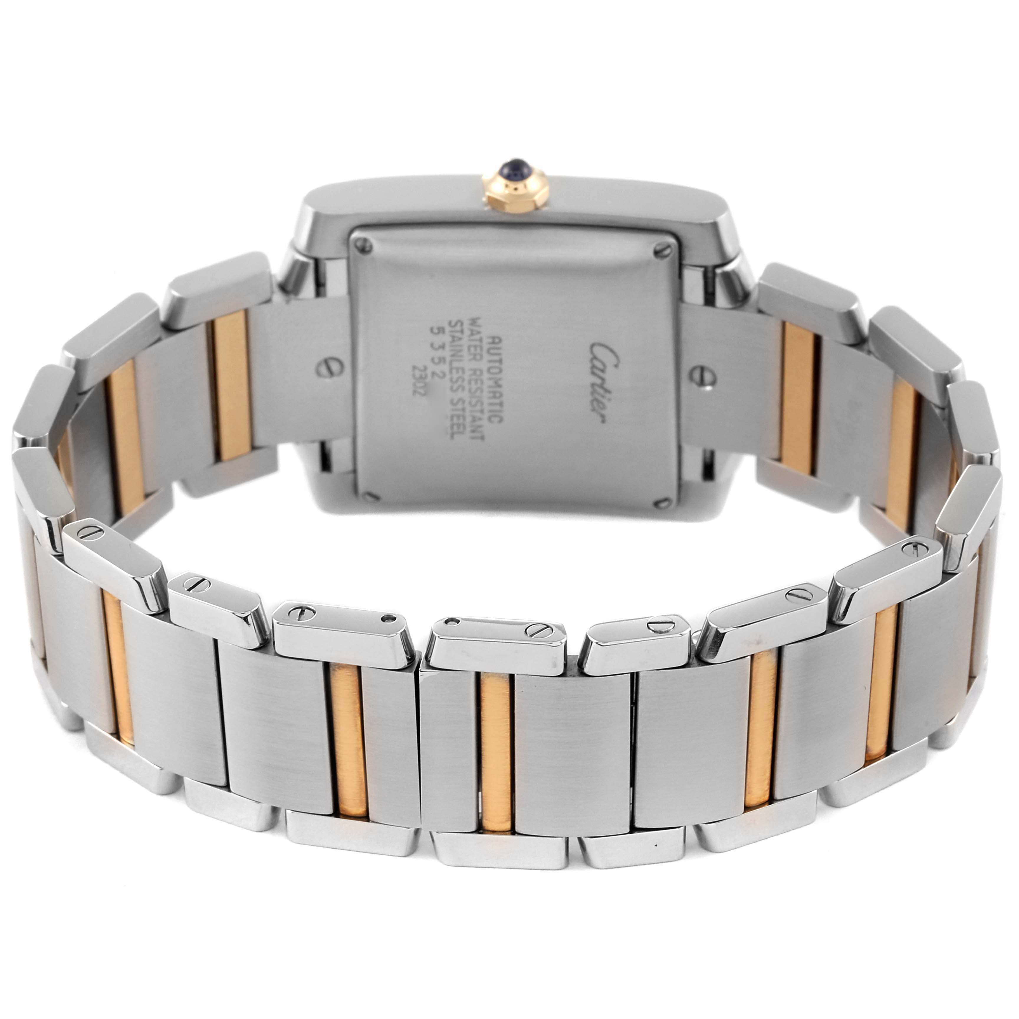 This image shows the back and part of the band of a Cartier Tank Française watch, highlighting its bi-metal bracelet and case back.