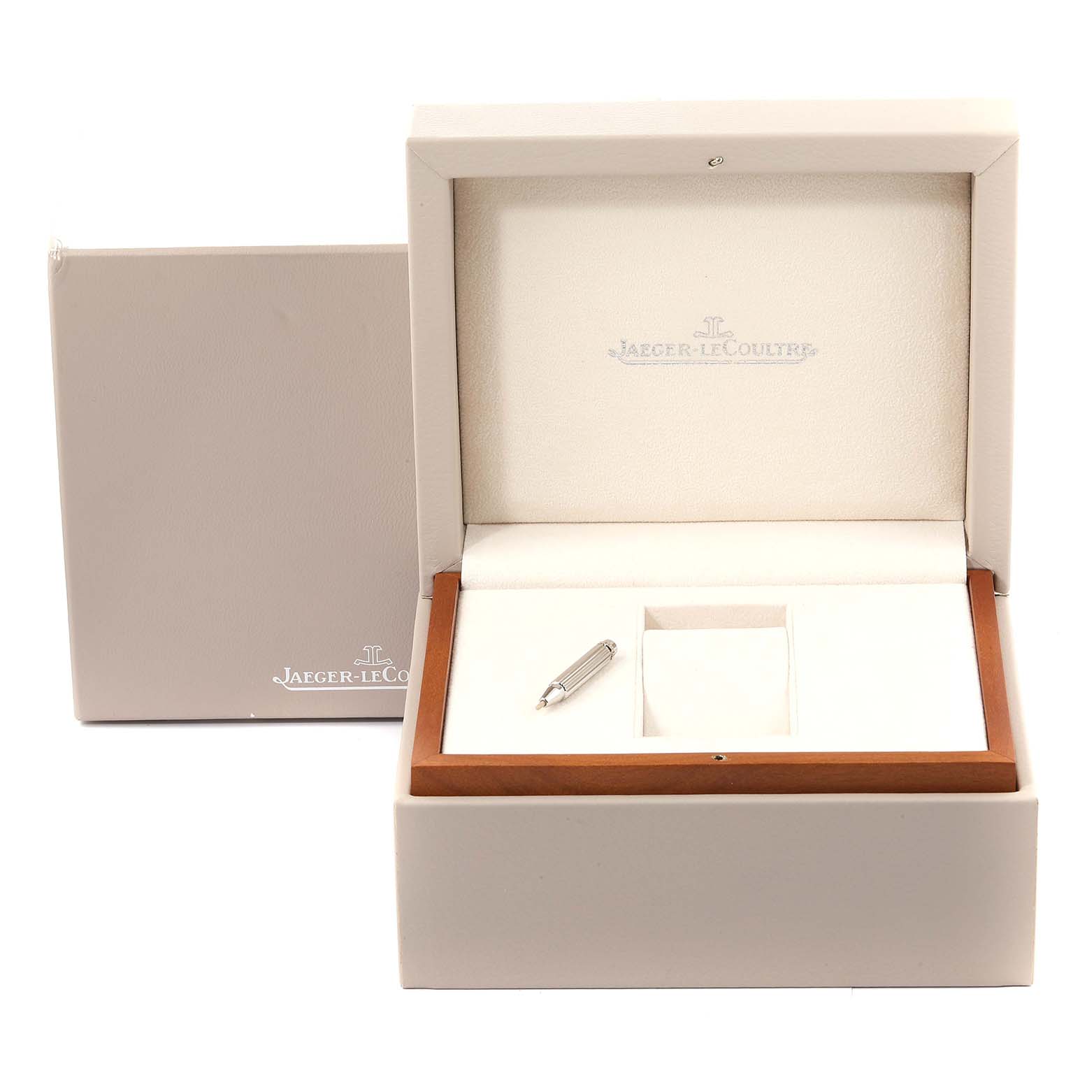 The image shows an open presentation box and manual for a Jaeger-LeCoultre Reverso watch, positioned at eye level.