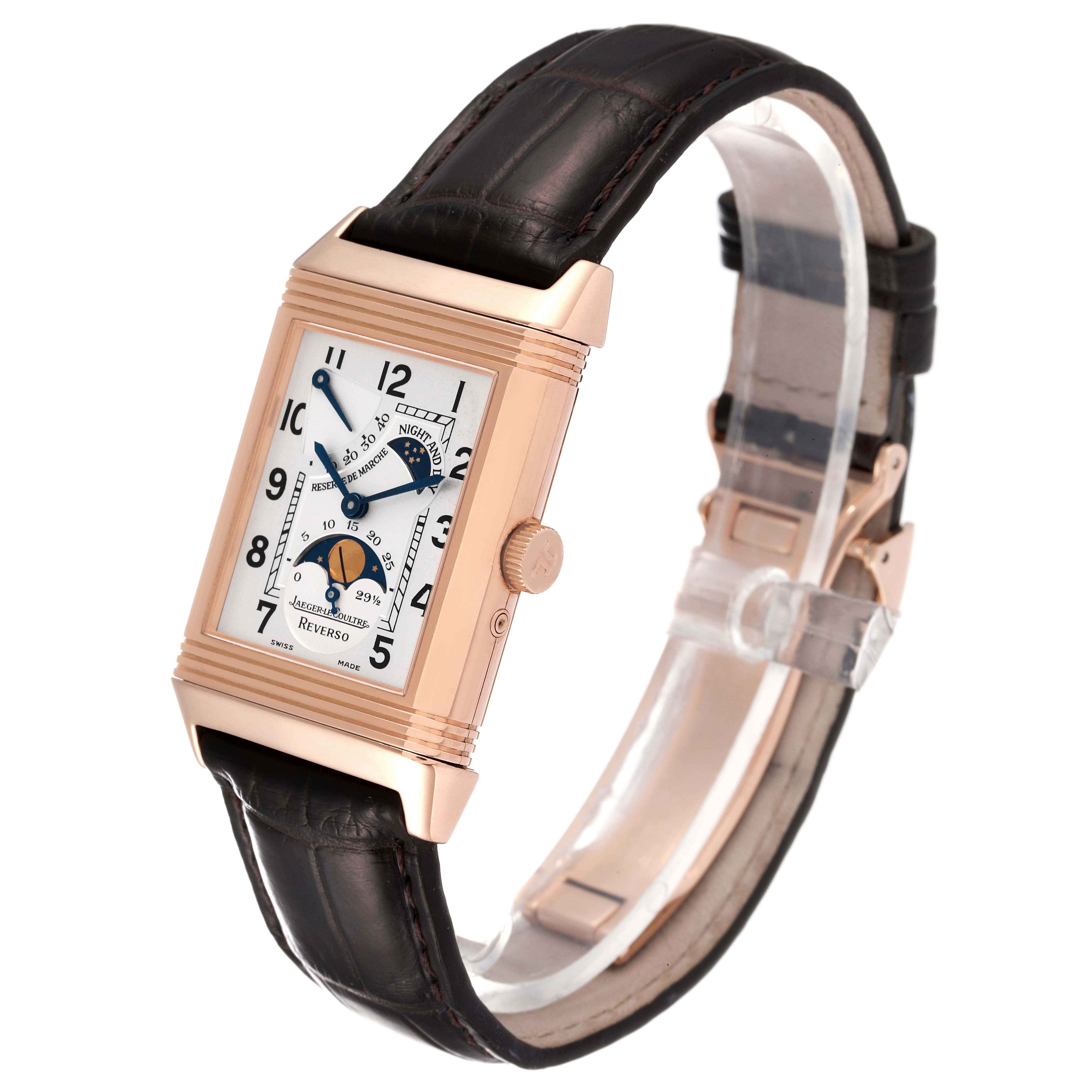 The Jaeger LeCoultre Reverso Q2752420 Men
s Rose Gold Silver Dial Q2752420 Men
s Rose Gold Silver Dial watch is shown from an angled side and front view, featuring a leather strap and detailed dial.