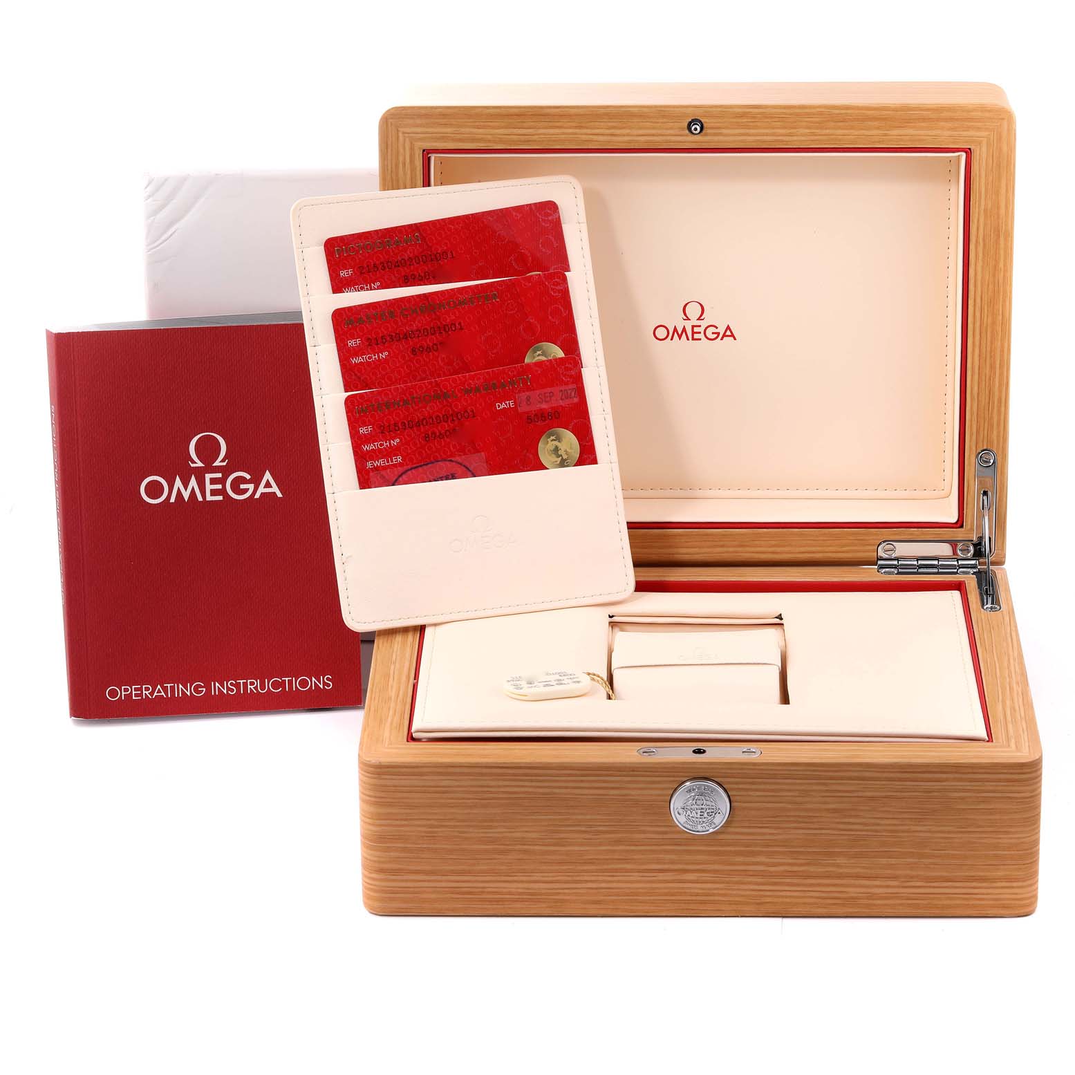 The image shows the packaging and accessories for the Omega Planet Ocean 215.30.40.20.01.001 Men's Stainless Steel Black Dial 215.30.40.20.01.001 Men's Stainless Steel Black Dial watch, including the box, instruction manual, and warranty cards.