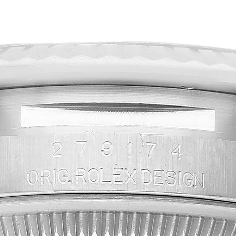 The image shows a close-up of the case back engraving of a Rolex Datejust 279174 Women's Stainless Steel Pink Dial 279174 Women's Stainless Steel Pink Dial watch, featuring its serial number and "ORIG ROLEX DESIGN."