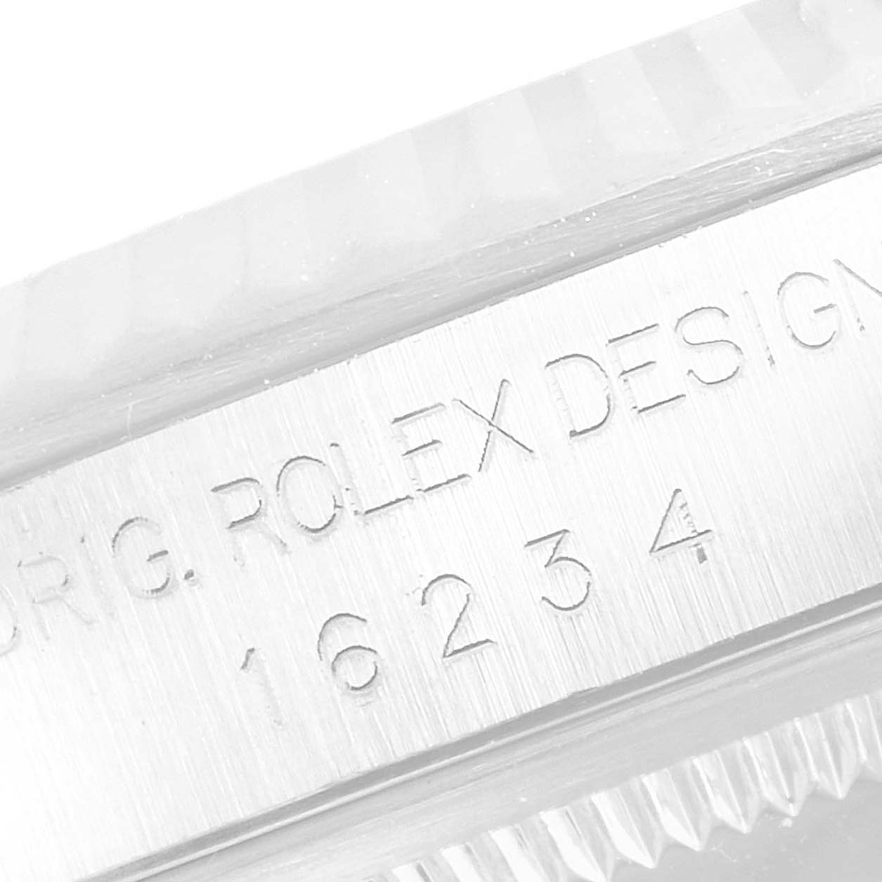 This close-up image shows the engraved model number "16234" on the side of the Rolex Datejust 16234 Men's Stainless Steel Blue Dial 16234 Men's Stainless Steel Blue Dial watch case.