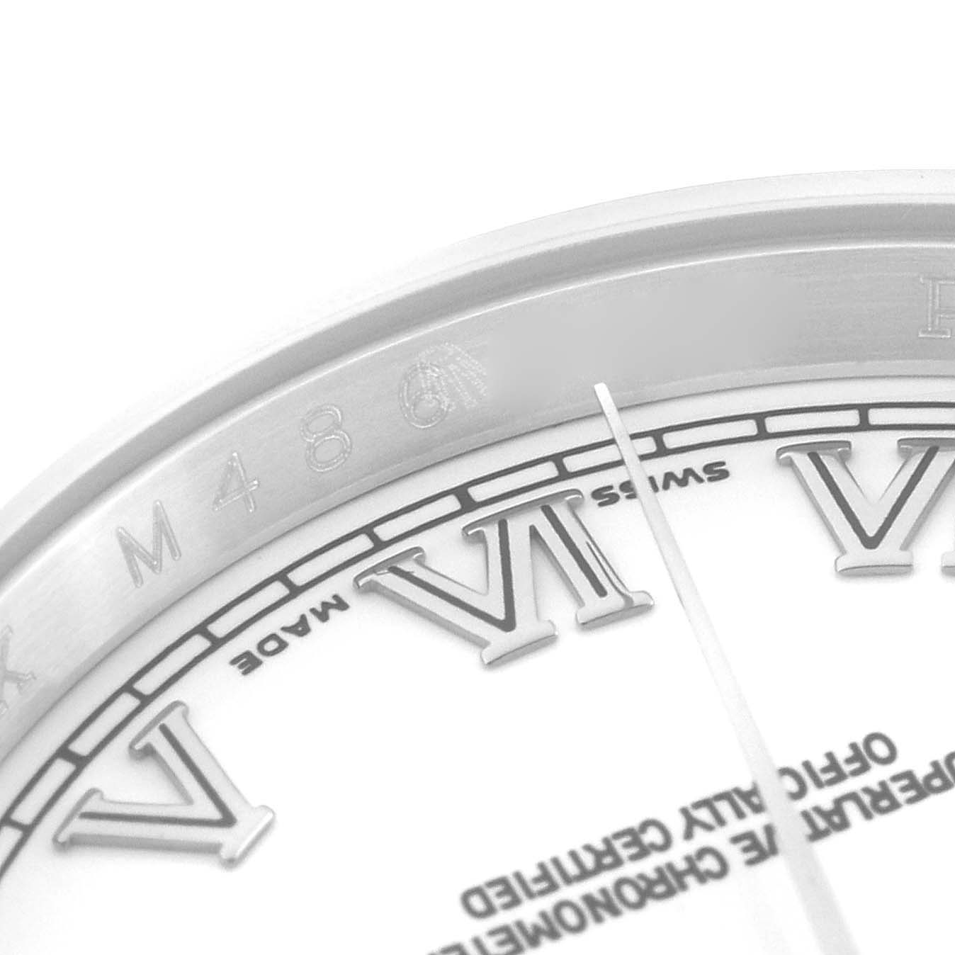 This image shows a close-up of the dial and inner bezel of a Rolex Datejust 116200 Men's Stainless Steel White Dial 116200 Men's Stainless Steel White Dial watch, displaying Roman numerals and part of the branding.