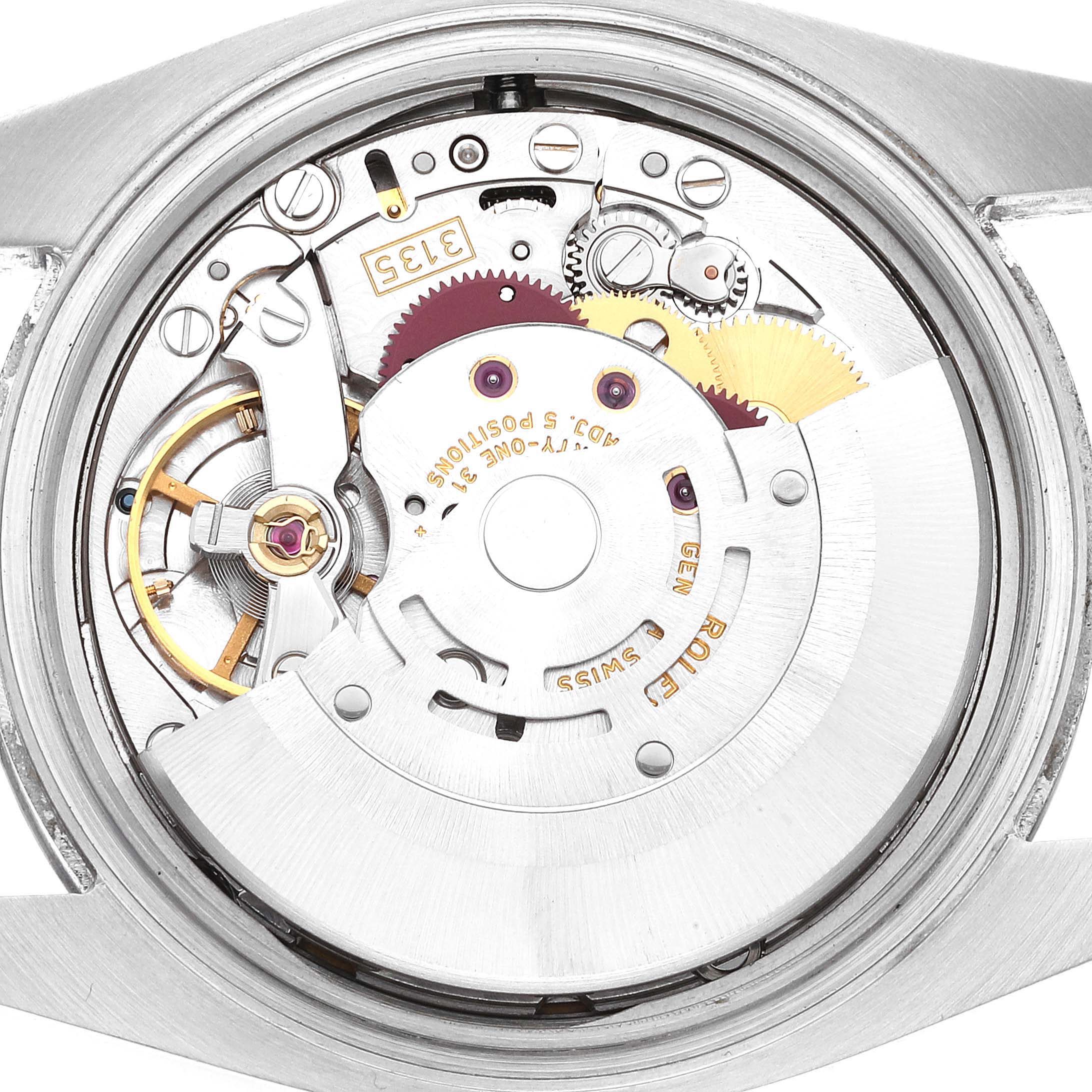 The image shows a close-up view of the movement and internal mechanisms of a Rolex Datejust 116200 Men's Stainless Steel White Dial 116200 Men's Stainless Steel White Dial watch.