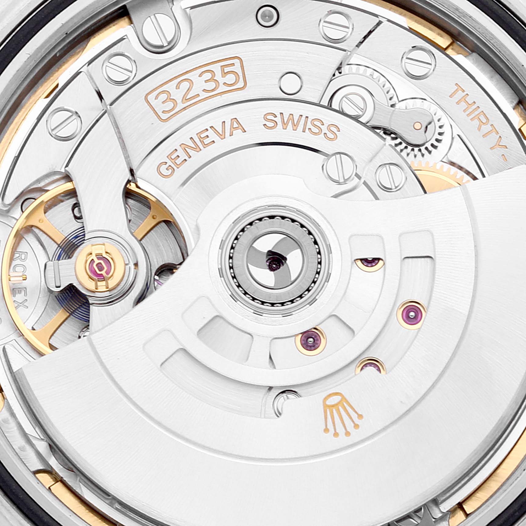 The image shows a close-up of the Rolex Datejust 41 126334 Men's Stainless Steel Mother of Pearl Dial 126334 Men's Stainless Steel Mother of Pearl Dial's movement, highlighting the intricate components and "GENEVA SWISS" engraving.