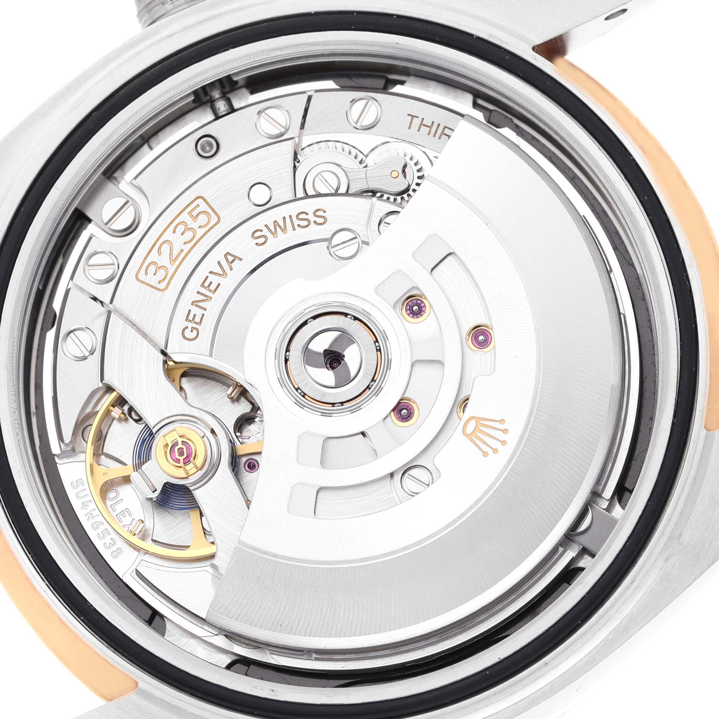This image shows a close-up of the movement and internal mechanisms of a Rolex Datejust 41 126303 Men's Steel and Gold (two tone) Black Dial 126303 Men's Steel and Gold (two tone) Black Dial watch, specifically the 3235 caliber.