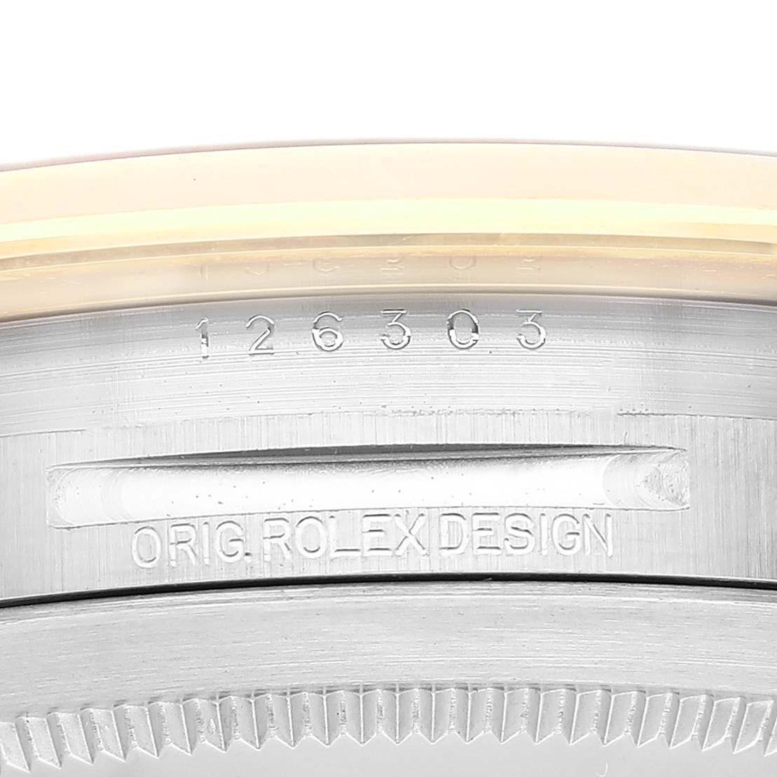 This close-up image shows the model number and design engraving on the metal case of the Rolex Datejust 41 126303 Men's Steel and Gold (two tone) Black Dial 126303 Men's Steel and Gold (two tone) Black Dial watch.