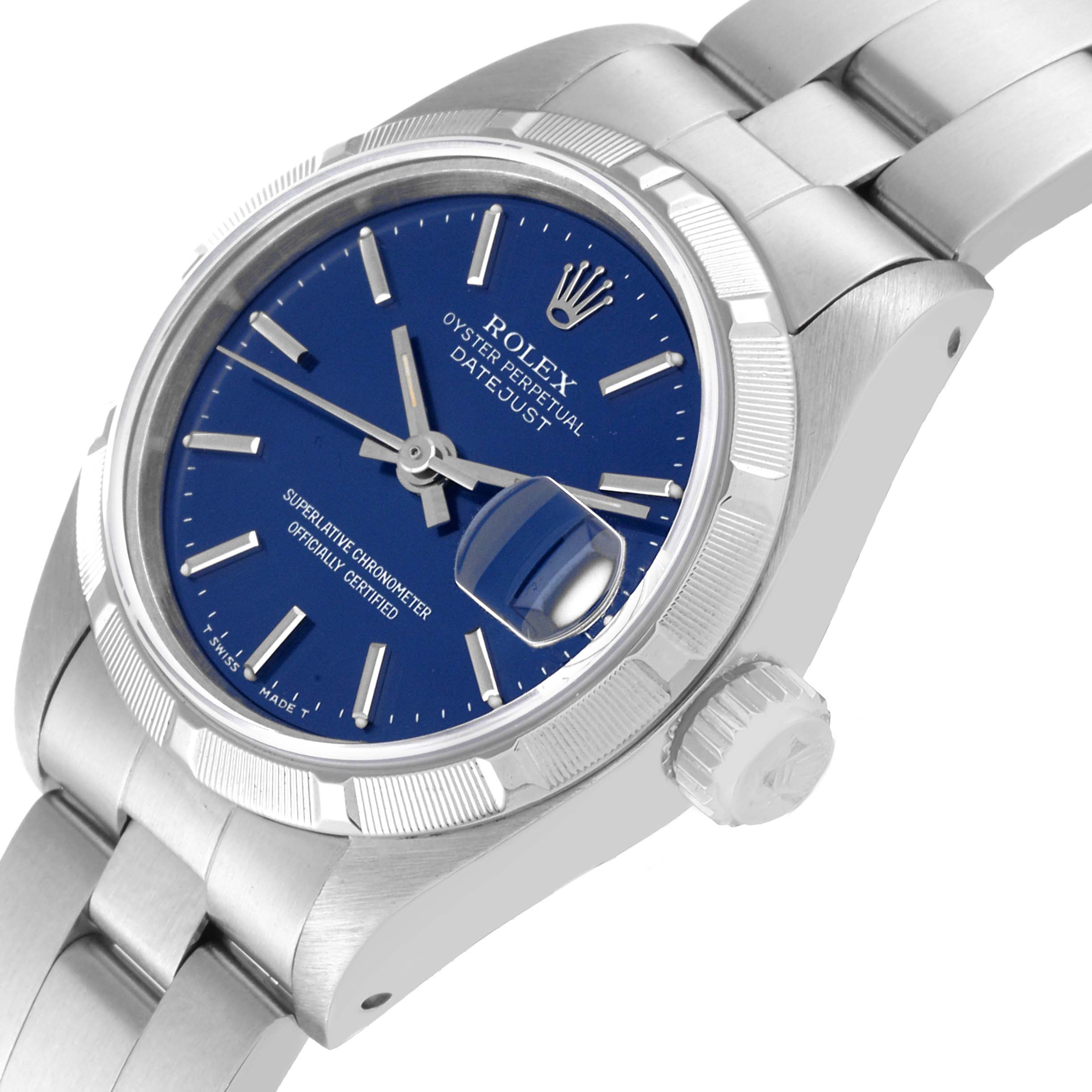 The image shows a close-up angle of a Rolex Datejust 69190 Women's Stainless Steel Blue Dial 69190 Women's Stainless Steel Blue Dial watch, highlighting the blue dial, bezel, crown, and part of the bracelet.