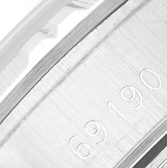 This image shows a close-up of the inner side of the band on a Rolex Datejust 69190 Women's Stainless Steel Blue Dial 69190 Women's Stainless Steel Blue Dial model, displaying the engraved serial number.