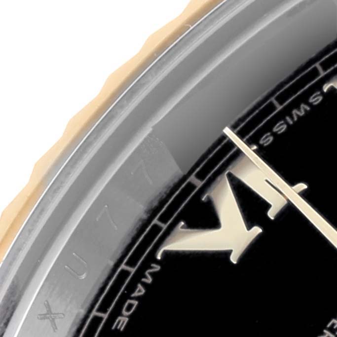 The image shows a close-up angle of the Rolex Datejust 41 116333 Men's Steel and Gold (two tone) Black Dial 116333 Men's Steel and Gold (two tone) Black Dial, highlighting the bezel, dial, and Roman numeral hour markers.