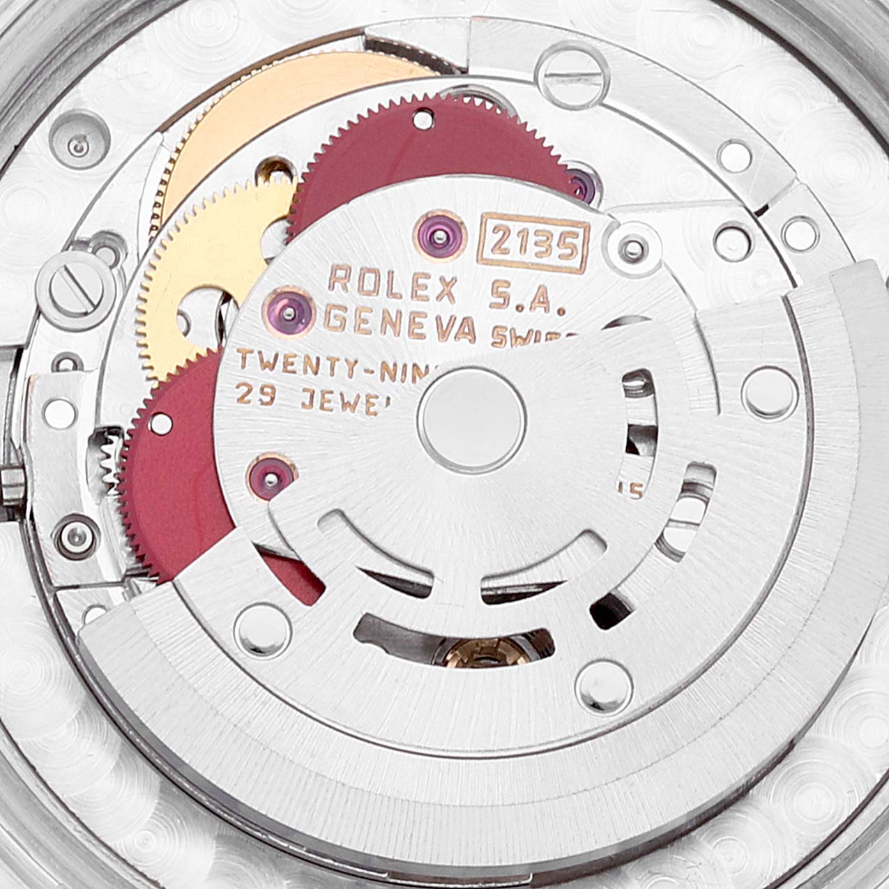 The image shows a close-up of the internal mechanism of a Rolex Mid-Size 68273 Women
s Steel and Gold (two tone) Champagne Dial 68273 Women
s Steel and Gold (two tone) Champagne Dial watch, highlighting parts of the movement.