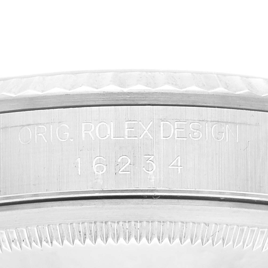 The image shows a close-up of the side of the Rolex Datejust 16234 Men's Stainless Steel White Dial 16234 Men's Stainless Steel White Dial watch case, displaying the engravings "ORIG. ROLEX DESIGN 16234."
