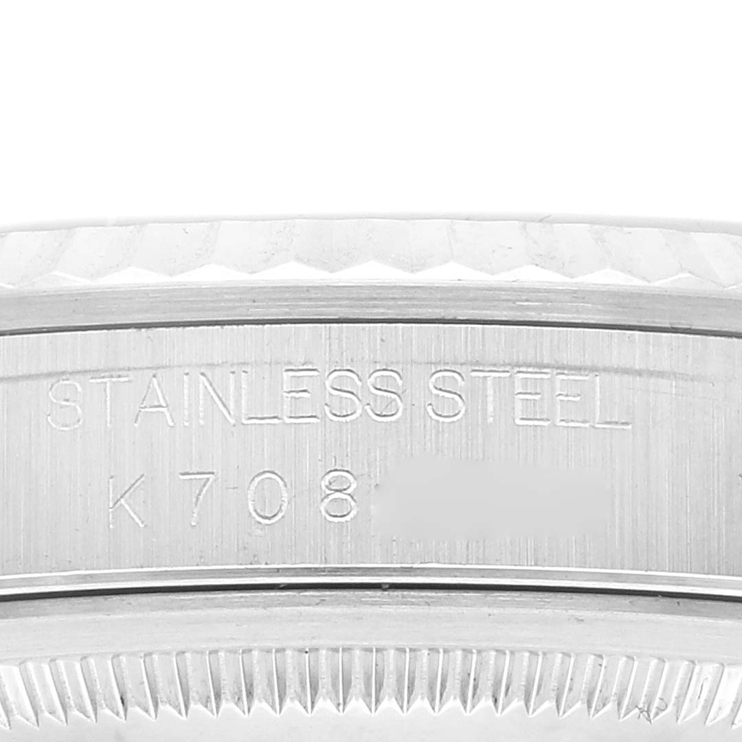 This close-up image shows the stainless steel case back of a Rolex Datejust 16234 Men's Stainless Steel White Dial 16234 Men's Stainless Steel White Dial model with engraved inscriptions.