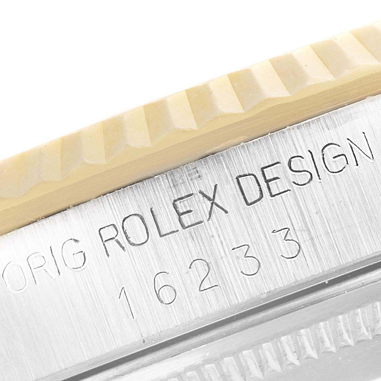 The image shows a close-up of the Rolex Datejust 16233 Men's Steel and Gold (two tone) Champagne Dial 16233 Men's Steel and Gold (two tone) Champagne Dial model 16233, highlighting its engraved bezel and case.