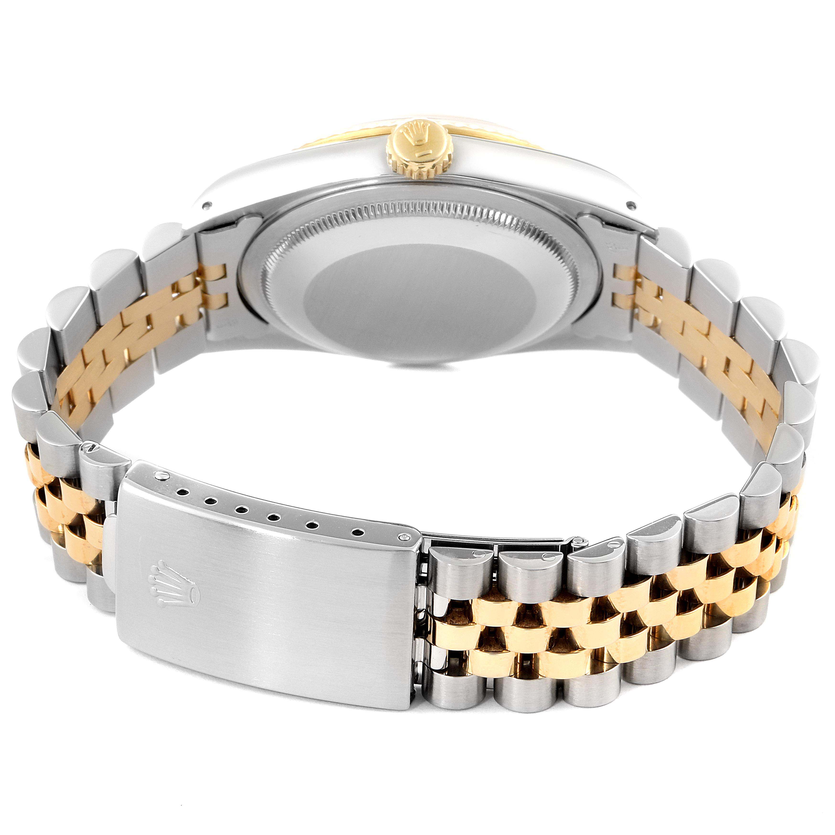 The image shows the back view of a Rolex Datejust 16233 Men's Steel and Gold (two tone) Champagne Dial 16233 Men's Steel and Gold (two tone) Champagne Dial watch, including its two-tone metal bracelet and clasp.