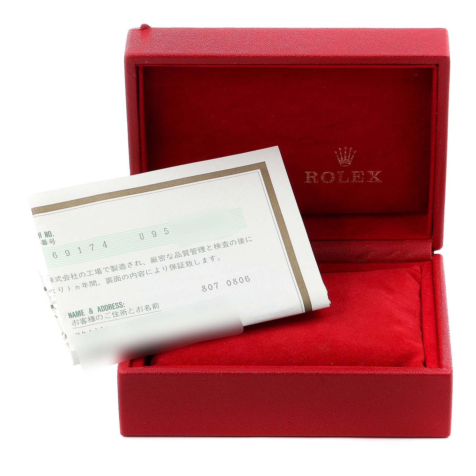 The image shows a red Rolex box for the Datejust model, with paperwork placed inside.