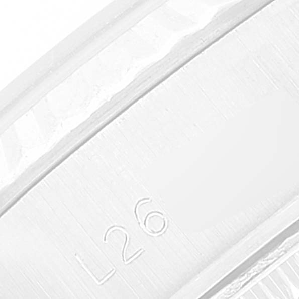 This close-up image shows a side view of the inner case of a Rolex Datejust 69174 Women's Stainless Steel Silver Dial 69174 Women's Stainless Steel Silver Dial watch, highlighting an engraved detail.