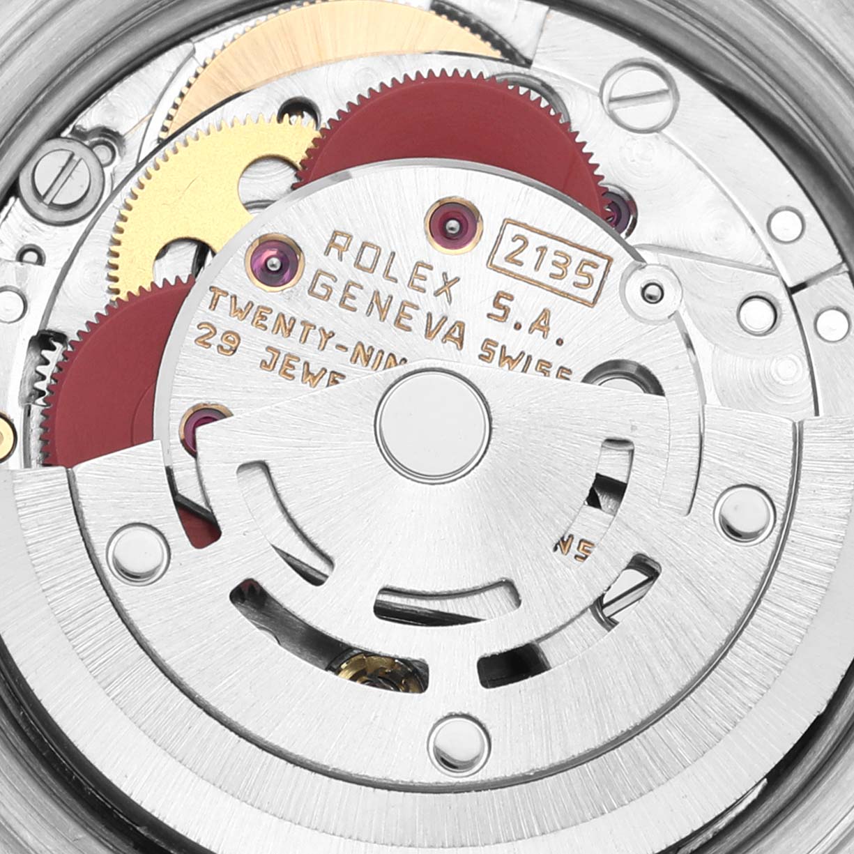 This image shows a close-up view of the Rolex Date 69173 Women's Steel and Gold (two tone) Champagne Dial 69173 Women's Steel and Gold (two tone) Champagne Dial model's movement mechanism, highlighting gears and markings.