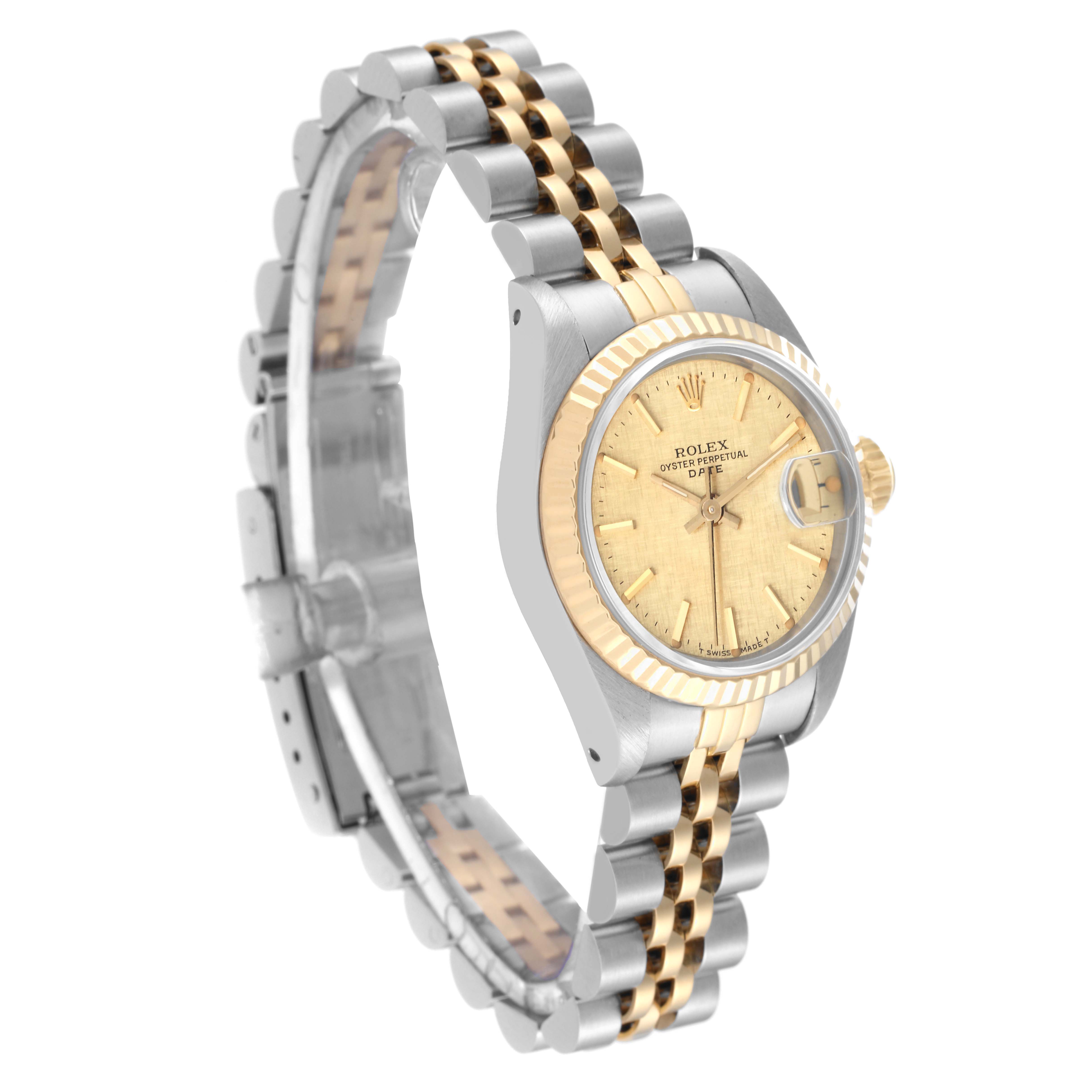 The image shows a Rolex Date 69173 Women's Steel and Gold (two tone) Champagne Dial 69173 Women's Steel and Gold (two tone) Champagne Dial model watch angled to display the face, crown, and two-tone metal strap.