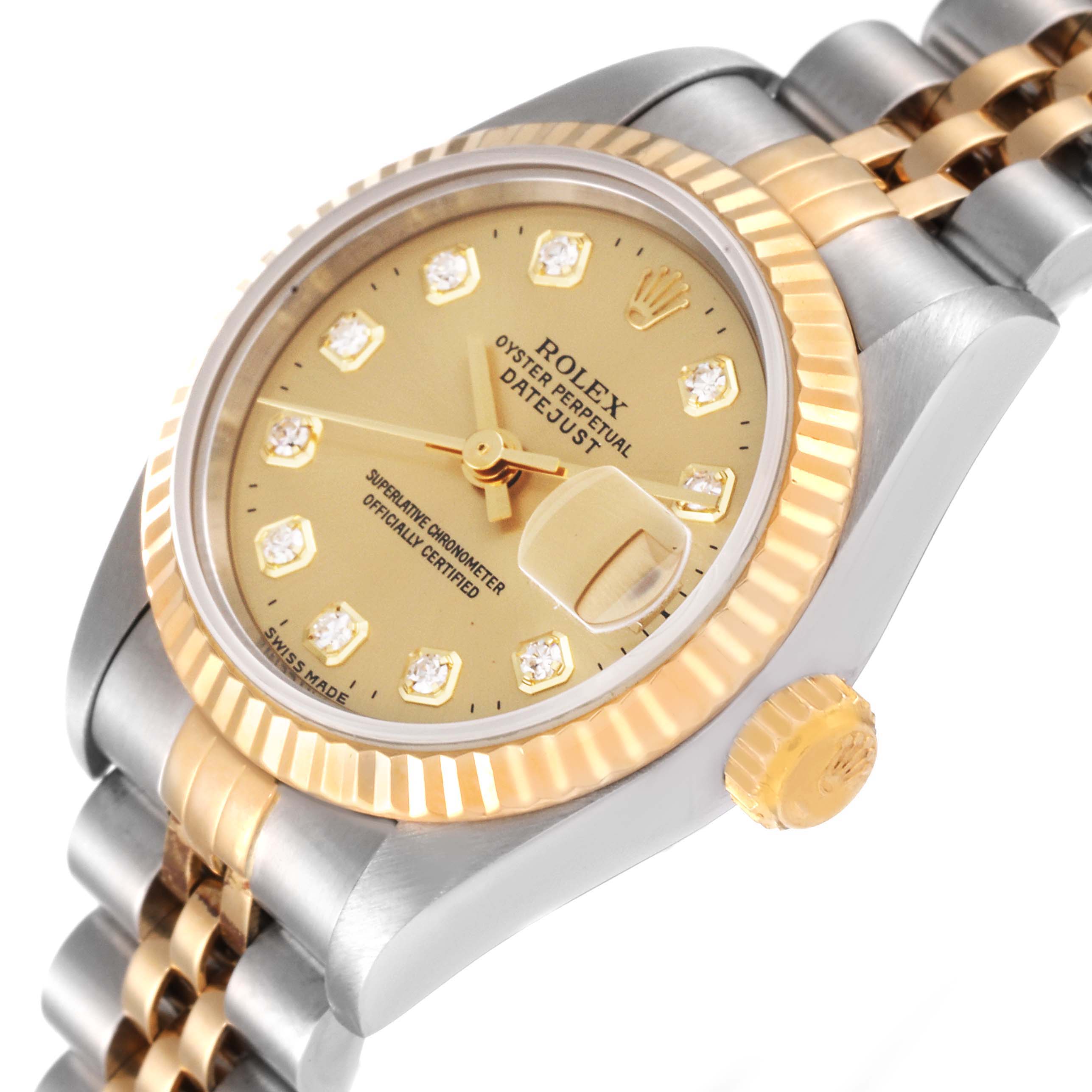 This image shows a close-up, angled view of the dial, crown, bezel, and part of the bracelet of a Rolex Datejust 69173 Women's Steel and Gold (two tone) Champagne Dial 69173 Women's Steel and Gold (two tone) Champagne Dial watch.
