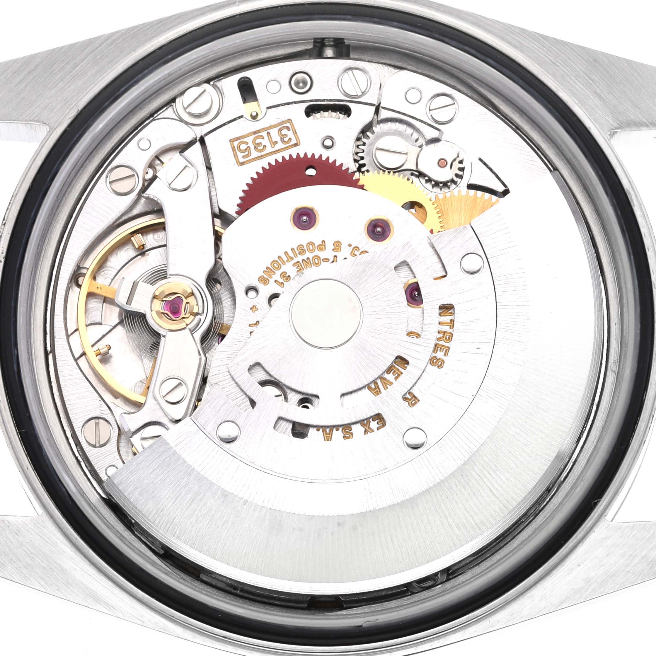 The image shows a close-up of the Rolex Datejust 16233 Men's Steel and Gold (two tone) Champagne Dial 16233 Men's Steel and Gold (two tone) Champagne Dial's movement and internal components from a back angle.